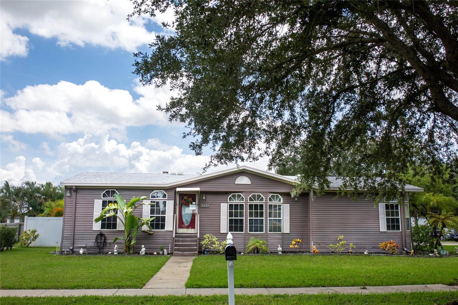 Discover the perfect blend of space, convenience, and opportunity with this spacious manufactured home nestled in a quiet, sought-after Riverview location. This corner lot property is ideal for first-time homebuyers or savvy investors looking to make their mark! Featuring a separate standalone garage/storage, you'll have plenty of room for your tools, toys, or additional storage needs. Enjoy the beauty of your own backyard, complete with thriving fruit trees, perfect for relaxing or entertaining friends and family in the large Lanai. With NO HOA fees, you can truly make this home your own without restrictions. While the home does need some updates, it's fully livable and ready for your personal touch. Don’t miss out on this exciting opportunity to own a piece of Riverview! Schedule a showing today and imagine the possibilities!