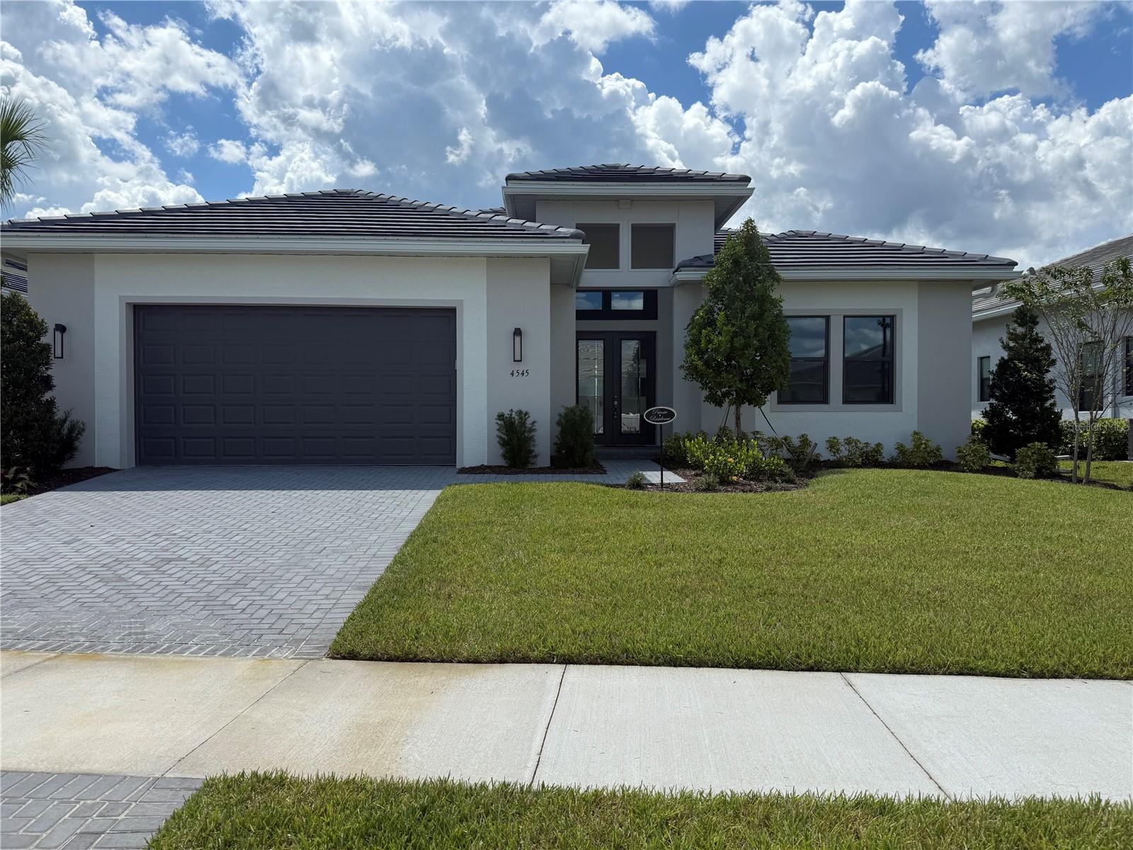 ANNUAL RENTAL...Brand new build in the most sought after ARTISTRY SARASOTA community. This stunning home will dazzle you the moment you enter the front door with it's 14-15 ft. ceiling and expansive sliding glass doors leading to a beautiful heated, salt water pool & hot tub overlooking a lake. Screened lanai with panoramic screens allows no obstruction to the lovely view of the lake. This home offers 4 bedrooms & 3 full bathrooms. The primary suite is en-suite featuring dual sinks and a large walk-in closet. The second bedroom also has it's own en-suite bathroom. Gourmet kitchen features luxury cabinetry, an oversized island, a 5 burner gas range. Casual dining nook and a formal dining space. Oversized two car garage. Artistry Sarasota is a new home community in Sarasota, Fl. This gated community is situated away from the congestion in the growing Sarasota East area, which offers residents easy access to the best shopping, dining, beaches, recreation and entertainment. Many top ranked golf courses, including the Founders Club & Laurel Oak
Country Club located in the immediate vicinity. Artistry amenities include: heated saltwater lap pool, fitness center, pickleball, basketball, playgroung and scenic trails. Call now to schedule a private showing.