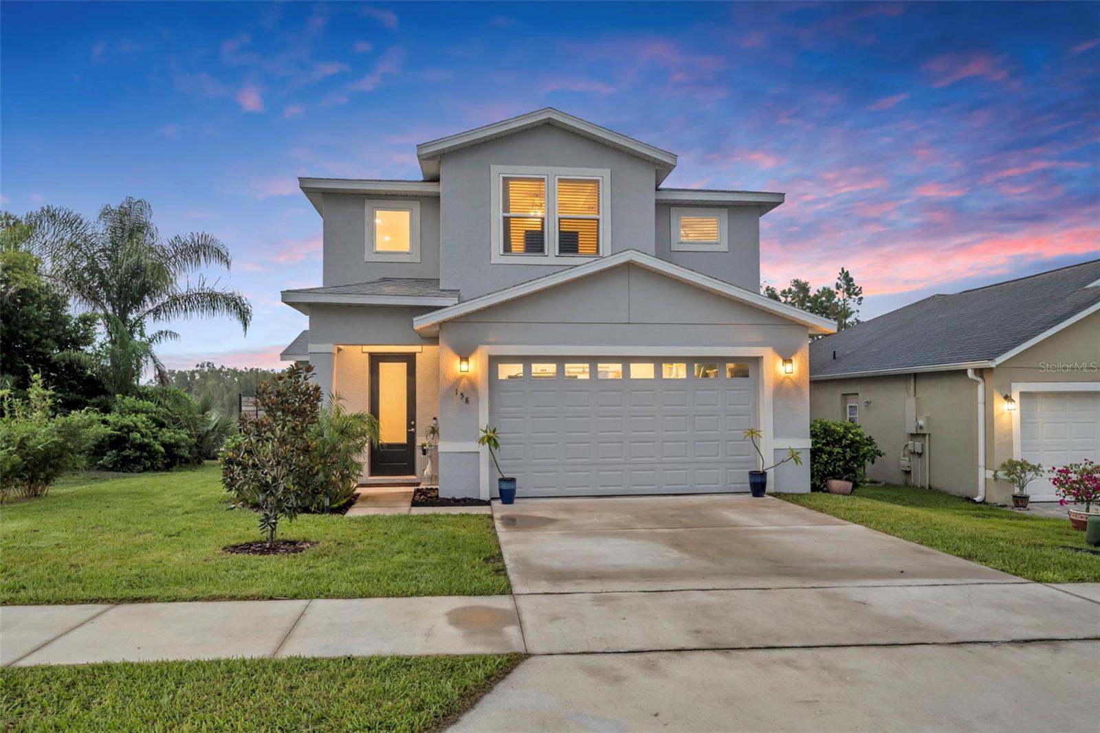 Welcome to your waterfront retreat on Lake Loch Lowe! This quality built 3-bedroom, 2.5-bath home was completed in 2022 and offers nearly 2,000 square feet of modern living. Step inside to find an open and airy floorplan featuring luxury vinyl plank flooring, light and bright finishes, and stylish design details throughout. The gourmet kitchen boasts quartz countertops, 42” upper cabinets, stainless steel appliances, and a convenient closet pantry—perfect for everyday living and entertaining. Upstairs, all bedrooms are thoughtfully situated, including a spacious primary suite with a huge walk-in closet, dual sinks, and a spa-like feel. Outside, enjoy stunning waterfront sunsets from your newly built illuminated and covered back porch, or launch a canoe or kayak right from your backyard for a day on the water. Additional features include a 2-car garage, move-in-ready condition, and a prime location in the highly sought-after Lake Mary High School District. Just one mile from charming downtown Lake Mary and minutes to shopping, dining, 417, and the airport, this home combines modern convenience with tranquil lakefront living.