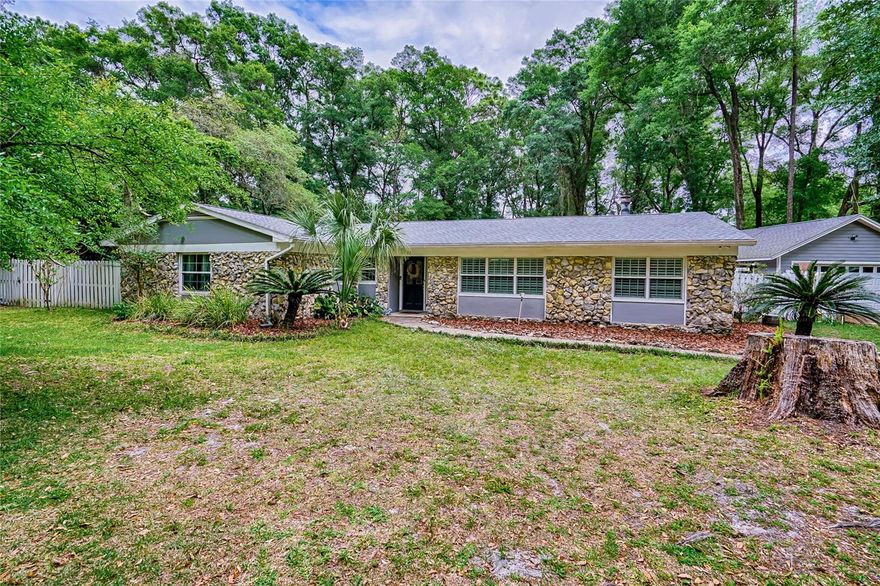 One or more photo(s) has been virtually staged. This is a remarkable home in Sunningdale on a cul de sac features two living spaces and a guest suite!  Resting on over an acre you will love the complete remodel of this home.  The kitchen is ready for any chef with huge island with a sink and an additional sink overlooking back yard.  Gorgeous granite countertop, gas cook top and stainless frig, microwave and dishwasher will make any cook happy!  The two big living spaces provides space for the kids and adults to enjoy what they like to do.  Both living spaces has a fireplace and has beautiful hardwood floors.  Master suite is oversized with long master closet to fit most everything and an additional wall closet.  The beautiful master bath you will certainly enjoy the light and bright cabinets, countertops and walk in shower.  The bedroom across from master opens to the monster Florida style room that has great views of the back yard. This room can easily be a game room for the kids or a relaxing area for adults!  One other kids/guest room and hall bath complete this area wonderfully.  Headed to the back of the house to the guest/in law suite you will love how spacious it is.  Connected to the second living space your guests/in laws will have their own area to enjoy.  This one acre plus lot gives room to do just about anything you want to in the front or the back yard.  Gorgeous trees for shade and comfort finishes this home to a T!   The in law suite and living room have separate doors to each room.  This could be a great Air BNB option for you too!  Another great use could be for home schooling to have big rooms for teaching! Roof is about a year old.