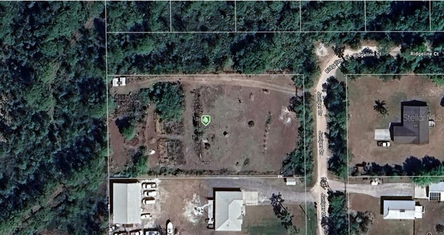 Welcome to 852 Juniper Dr, Christmas, FL 32709 a cleared, build-ready opportunity totaling about 1.10 acres (48,000 sq ft) made up of three combined parcels sold together. The property sits outside the flood zone (per available records; buyer to verify), giving you peace of mind and more flexibility for future improvements. With the land already open and usable, you can move quickly on site planning for a custom home, workshop, or extra parking for boats, trailers, and equipment. Enjoy the small town feel of Christmas with convenient access to major corridors, beaches, and Orlando attractions. All while having room to spread out. Bring your ideas and make this versatile tract your own. Has electric and well installed