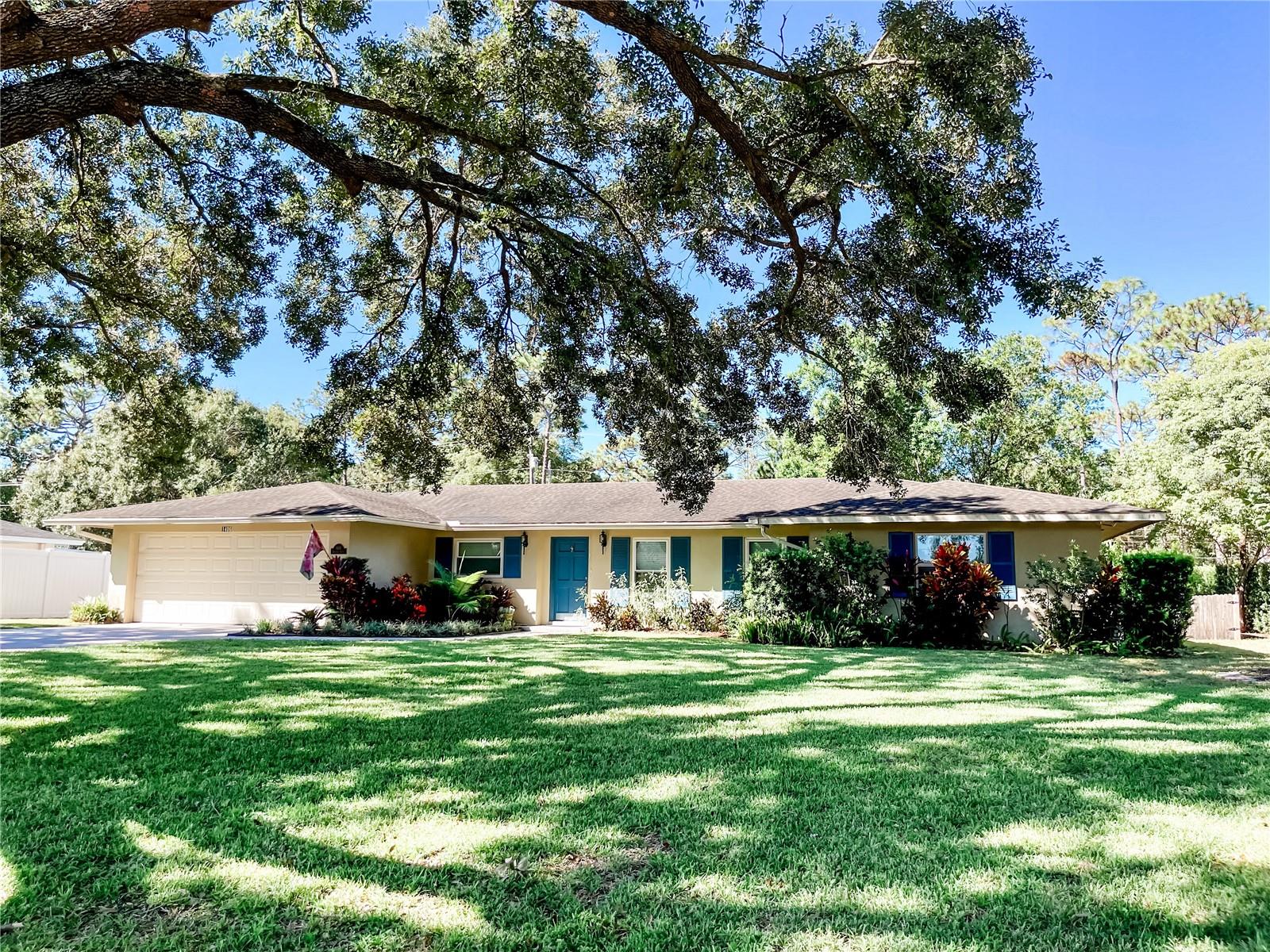 Beautiful 3 bedroom/2 bath home + Florida room in desirable Rio Pinar Country Club Estates! Open and spacious floor plan with hardwood floors throughout living room, dining room, family room and bedrooms. Charming kitchen with breakfast nook, stainless steel appliances and wood cabinets. Primary en-suite has walk-in closet, dual vanity sinks and shower stall. Large Florida Sunroom with ceramic tile is bright, great for entertaining and relaxing while overlooking oversized, lush fenced backyard. Large open back patio. Lot sits on 1/3 acre with tree lined streets. Lawn service is included. No pets. Excellent location near 408, Waterford Lakes, Advent Health, Lockheed Martin, UCF, Orlando International Airport, restaurants and shopping.