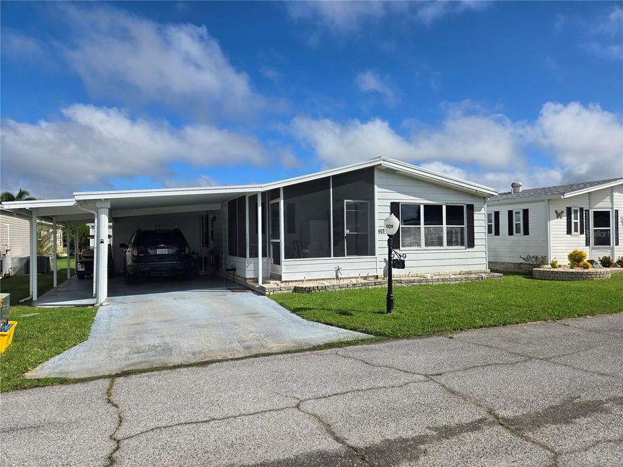 Own your land and run your own life as this is a community owned by the residents and we make the decisions (I live here!) The HOA includes everything except your electric bill and lawn mowing! 2/2 perfect for SnowBird or Retirement! The kitchen provides adequate counter space, newer applicances, and the bathroom have Hi-Rise Toilets.  Both bedrooms are well-sized and have accommodating closets. The delightful front Florida Room has been added to the living space and AC, plus there is a front screened lanai.  The shed is where the washer/dryer hookup is.  The Shed was completely replaced in 2023.  This financially sound, gated golf community has structured itself to enjoy the good life! Enjoy 18 holes of golf for just $5 green fees in this Gated, Golf Community, located just outside of the city, and approx. 1.25 hrs. from either coast. Great access to Disney, Legoland, and BOK Tower, just to name a few local attractions. In this very friendly, resident-owned community, you can be as active or inactive as you choose! Gatherings at the private Pub or the Community Room, fishing & boating on Lake Henry (dock within the community), gardening, tennis, golf, shuffleboard, pickle ball, horseshoes, swimming in the heated pool, enjoy the hot tub or the 24/7 workout room! Contact this community's website for documents, including Rules/Regs, Application, Financial, and Bylaws. HOA INCLUDES A DVR PLUS 2 HD CABLE BOXES AND INTERNET! (Minimum age in this 55+ community is 50 years old)
