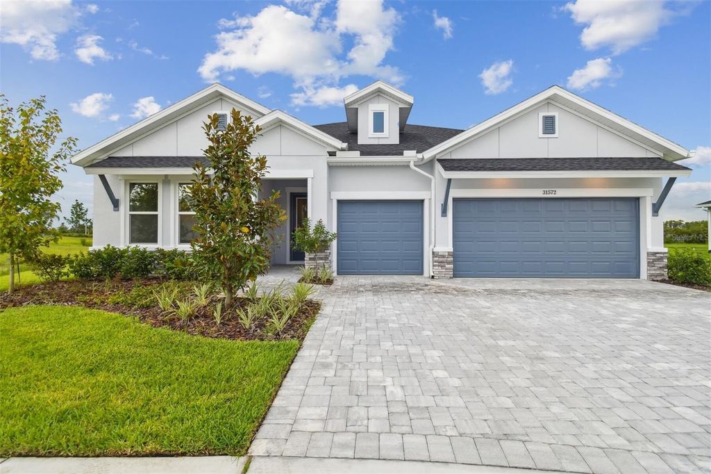 Photo of 31572 Hayman Loop, Wesley Chapel, FL 33545 (MLS # TB8426690)