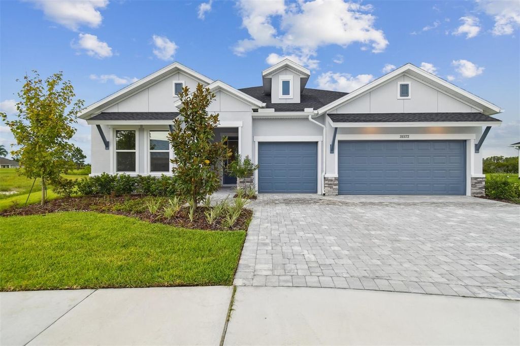 Photo of 31572 Hayman Loop, Wesley Chapel, FL 33545 (MLS # TB8426690)