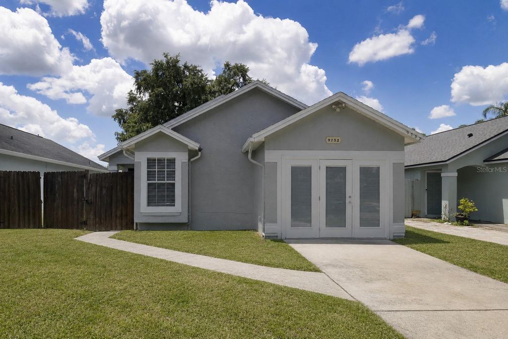 Photo of 9752 Piney Point Circle, Orlando, FL 32825 (MLS # O6422838)