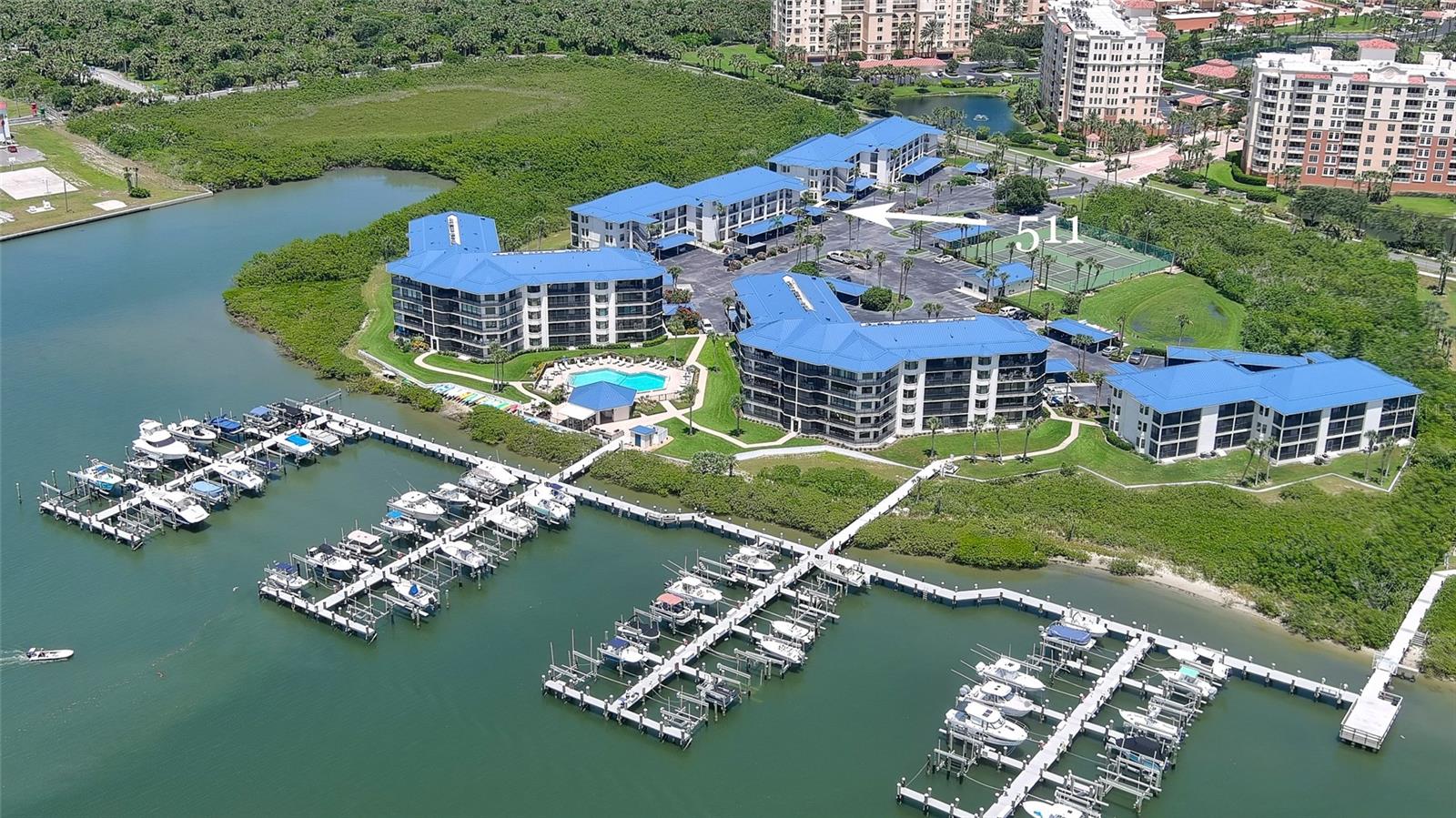 Inlet Marina Villas is a small riverfront community with a private clubhouse, riverfront summer kitchen & cabana, pool, BBQ grills, tennis & pickleball courts adjacent to a marina with boat slips & fishing docks. Situated next door to the 220 acre Smyrna Dunes Park which has 2 miles of boardwalks to the beach & the river & a dog friendly beach area! Immaculate & tastefully furnished, this 2BR/2BA ground floor condo includes a reserved covered carport just steps to your front door & a spacious screened balcony with large storage closet. Special features of this corner unit include 2 bay windows in both bedrooms which provide lots of natural sunshine & both have ensuite bathrooms. Enjoy the best of both worlds living on the river with spectacular views of sunsets, boating action & marine life plus private gated access to the beach through Minorca property across the street. The community has been recently renovated including new windows in 2022, a new roof in 2023 & has completed both inspection reports & are fully funded. Enjoy the heated pool plus riverfront clubhouse with summer kitchen, gas grills, fire pit, tennis and pickle ball courts, kayak/paddleboard storage and rest rooms. The Marina offers boat slips for rent, which feature electric, water, two fish cleaning stations & some of the best fishing since it is right next to Ponce Inlet. There is a wait list at this time for a slip, but you can still enjoy the docks for fishing & watching the boats sail by. Ride your bike or golf cart to the famous Flagler Ave just 2 miles away with bustling nightlife, restaurants and shopping. Enjoy the Florida lifestyle today that you deserve!