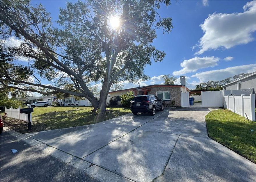 Available fully furnished! Move right in, or use as a plug and play vacation home! This 3-bedroom, 2-bath, 1807 sq ft home is in an incredible location approximately 1 mile from the Gulf Beaches and only a couple of blocks from the Largo Intercoastal Marina; Take a 3-minute stroll to your boat and enjoy the stunning scenery and coastal lifestyle and some of the best beaches in the U.S.! Two nature preserves within walking distance make this a fishing/boating/watersports/beach lover's dream! Located inside Largo City limits with minimal short-term leasing restrictions, with the option to use it as a vacation rental when not in use by your family (management services available)!

Despite the proximity to the water, the home is high and dry in a non-flood zone, allowing you to avoid the cost and risk associated with flood insurance, has a 50-year metal roof and hurricane clips to even further lower your insurance costs, and has been fully renovated, to include a new outdoor pavilion with custom pergola. The home also features a large (14 x 16) indoor storage room as well as a large (12 x 27) indoor workshop.

KEY FEATURES (as currently furnished): Minutes away from the white sands of Indian Rocks Beach (<1 mile), Beautiful new outdoor pavilion, fire pit, and grill, Walking distance to George C. McGough Nature Park (amazing and free nature reserve), marina, coffee shops, and restaurants, 3 large bedrooms with blackout blinds, including 1 king (with personal TV), 1 queen (with personal TV), and 1 full, 2 full bathrooms w/ showers + one bathtub, New outdoor furniture along with new propane grill, Open-concept kitchen; stainless steel appliances, and large dining area, Comfortable lounge area w/ a large flat-screen Smart TV, Outdoor games (corn hole, bocce ball, football and soccer), Beach supplies (beach towels, chairs, tent), Off-street parking, Indoor Washer & dryer

BEDROOMS & BATHROOMS:
This charming beach house boasts three tastefully decorated bedrooms, each of which is designed for ultimate comfort and relaxation.

The primary suite is a true retreat, featuring a king-sized bed, television, large closet, and blackout curtains for you to sleep and relax as long as you like. The second features a queen-size bed and the third bedroom features a double bed. All rooms have plenty of storage space in the  closets.

KITCHEN & LOUNGE:
The home boasts an open-concept kitchen and lounge area, perfect for entertaining and spending time with loved ones. The kitchen is fully equipped with stainless steel appliances, and a table for four to enjoy your morning cup of coffee. A dishwasher makes cleaning up a breeze so you can spend more time at the beach!

The lounge area is a comfortable and inviting space with a plush sofa and a large flat-screen Smart TV. The wall of windows allows for plenty of natural light to flood the space, creating a bright and airy atmosphere. The lounge is the perfect spot to unwind after a day at the beach, watch the big game, or just relax and read a book.