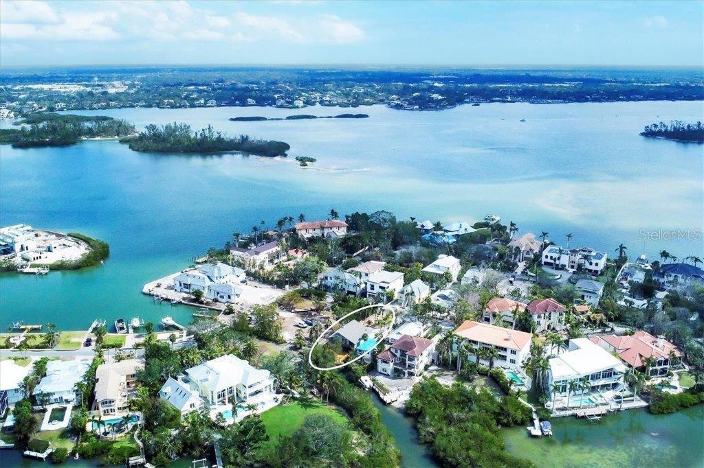 Discover the chance to own a meticulously maintained 4-bedroom, 3-bathroom home in Roberts Point—one of North Siesta Key’s most sought-after neighborhoods. This versatile two-story property is ready for you to move in, renovate, or rebuild into your dream retreat. Designed with entertaining in mind, the home offers multiple outdoor decks and living spaces, plus a relaxing hot tub overlooking the tranquil bayou. The property has water access to the bay and beyond. The main living area on the second floor features an open, airy layout with vaulted ceilings, while the ground level includes a two-car garage, private 1-bedroom/1-bath suite, bonus room, and screened lanai—perfect for guests or extended family. Recent upgrades provide peace of mind, including a new roof (August 2023), hurricane shutters, and completed storm remediation. Surrounded by lush Florida landscaping, you’ll enjoy the serenity of the water while being just minutes from Siesta Beach, shopping, and dining. Don’t miss this exceptional location—whether you envision updating, expanding, or starting fresh, this is your opportunity to own a slice of paradise on Siesta Key.