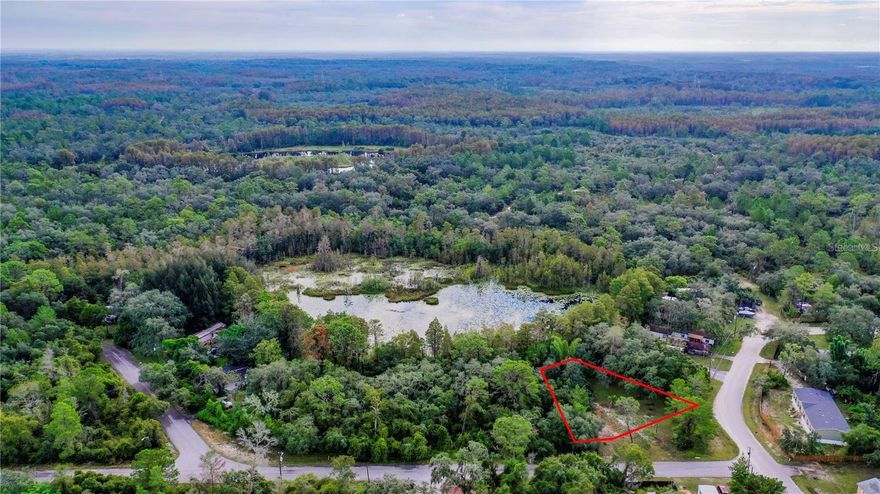 Discover the perfect canvas for your dream home in beautiful New Port Richey, Florida. This oversized corner lot sits on a stunning pond, offering breathtaking views and endless possibilities. Nestled in a non-HOA community, you’ll have the freedom to bring all your toys—boats, RVs, and more—without restrictions. Enjoy the peaceful surroundings while staying close to shopping, dining, and top-rated schools. Don’t miss this rare opportunity to own a piece of paradise. Sellers have the survey!