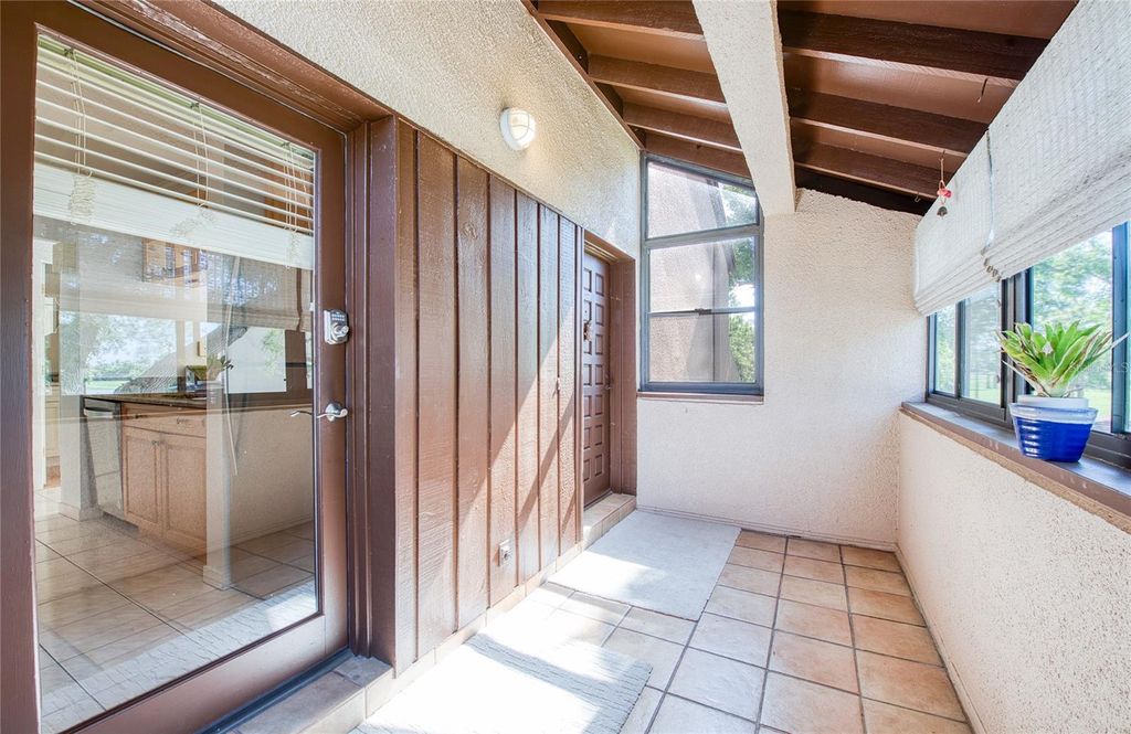 Photo of 6305 Pelican Creek Crossing #D, St Petersburg, FL 33707 (MLS # TB8503119)