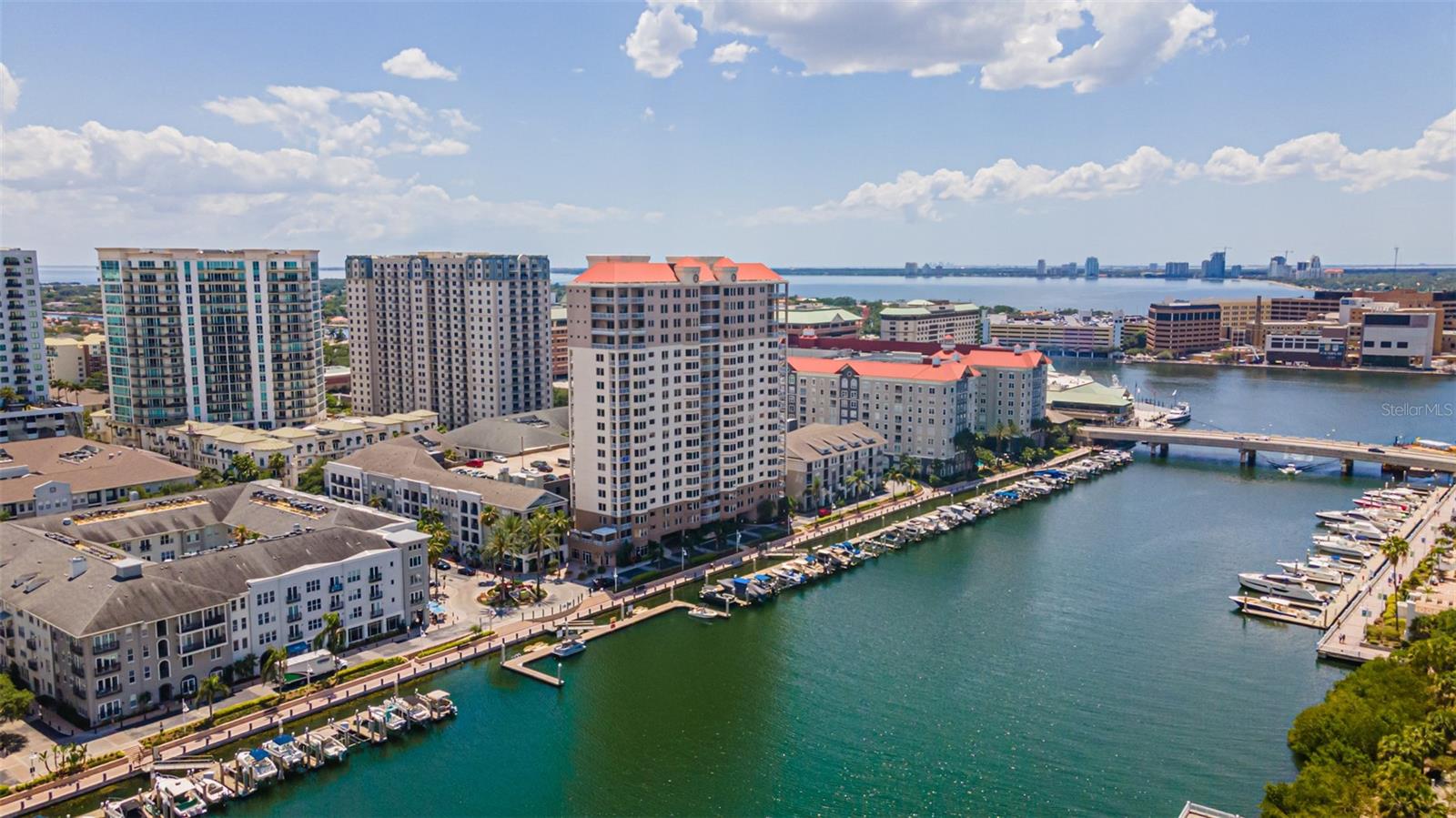 Under contract-accepting backup offers. PRICE IMPROVED!! No need to wait for new construction. Come experience Luxury Lifestyle in Tampa’s booming Downtown. Situated on Harbor Island, designated one of the best neighborhoods in America in 2023, the Grandview is the epitome of comfort and convenience. The sweeping waterfront views of the downtown skyline, and shimmering sunsets, are captivating. Enjoy easy access to parks, and entertainment. This location allows for the best of both worlds. Walk in relative privacy through your picturesque community without dodging crowds or traffic. All while being an accessible 5 minutes to the exciting action of Water Street, the Riverwalk, and Sparkman Wharf. This location has it all! Your intimate dwelling will not disappoint. There are only 34 units in this thoughtfully planned tower, providing ultimate privacy. Your 2 designated parking spaces have electrical power in case you travel frequently or choose to live seasonally. A secure elevator and entryway provide peace of mind. The community areas are light-filled and cheery, there are no long dark corridors here. Grab your deliveries from your welcoming concierge, before whisking up to your pristine home. Your private floor includes a 600-square-foot storage closet and only one neighbor. Upon entering your completely updated and modern residence, the Downtown Tampa skyline beckons you. The open floor plan offers you an efficiently equipped kitchen designed for cooking and entertaining. It boasts lustrous custom cabinetry with pullouts, a Subzero built-in refrigerator, a retractable oven hood, and a Wolf induction stove. There is still plenty of space for a grand-sized table that easily seats a jubilant crowd of Gasparilla revelers. Lose yourself sitting in the nook adjacent to the kitchen with 180-degree views of downtown action. Your main living space invites movie nights or intimate discussions. 3 oversized bedrooms surround the open concept. The primary bedroom delights with ample light and space. The secluded private balcony provides the perfect canvas for morning coffee and contemplation. The exquisitely appointed primary bath is awash in light. It is covered in luxurious porcelain tile, and seamless stone counters and hosts an oversized walk-in shower, double sinks, illuminated mirrors a walk-in closet, and extra storage. The remaining 2 rooms are hardly secondary! The south guest room with its sleek and modern ensuite is ideal for your traveling guests. The north guest room with a full bath just outside is ideal for an office and Tampa Bay Lightning enthusiasts. The direct and personal view of the Amalie Arena transports you into the winning spirit of Champabay! Tucked away by the home's entrance is a fully outfitted laundry room, with a utility sink, and provisions storage. There is a coat closet nearby for additional storage and organization. Life is easy here! This exclusive residence feels like a carefree, single-family home with all the comfort and luxury of downtown living. Just minutes from Tampa international airport and world-renowned beaches, this location has it all! Why wait for what may come when you can have everything right now? Come experience this exclusive Grandview residence and make it your private haven today.