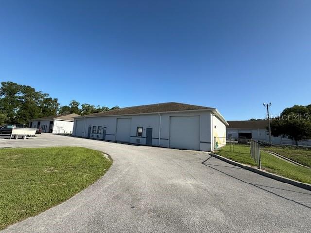 1,836 SF Warehouse with M-2 Zoning! Unit 101 has one office with a PTAC unit and bathroom. Balance is warehouse, which has a water cooler and wash sink. Ground Level roll-up door and plenty of paved areas. Excellent location for service type businesses and well located with easy access to food, shopping and services.