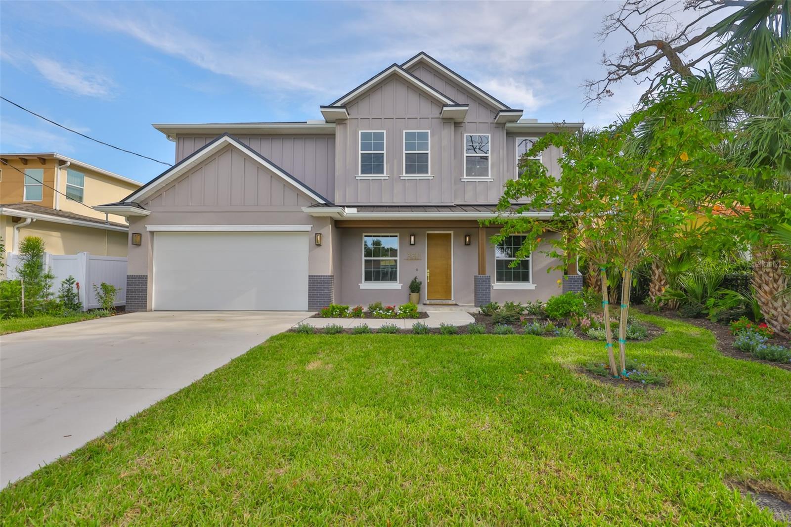 If you're tired of the cookie-cutter homes with the same white shaker cabinets seen everywhere, this CUSTOM-DESIGNED HOME is the perfect alternative. With warm, on-trend finishes in blonde, honey, and gold tones, this stunning modern residence stands out from the rest. Nestled on a fully fenced oversized lot in one of Tampa's most sought-after neighborhoods, it offers both style and comfort in a truly unique package. This stunning 5-bedroom, 4.5-bathroom, 3,196 sq ft two-story home, built with superior quality and design. Constructed with a block ground floor and wood-frame upper level finished with durable Hardie Board Lap Siding, this residence is equipped with HURRICANE IMPACT WINDOWS AND DOORS throughout for peace of mind. Step inside to an open-concept main floor showcasing a chef-inspired kitchen with CUSTOM MODERN CABINETRY, ELEGANT QUARTZITE COUNTERTOPS, AND PREMIUM FISHER & PAYKEL APPLIANCES, INCLUDING AN OVERSIZED INDUSTRIAL-STYLE REFRIGERATOR, INDUCTION RANGE AND WINE FRIDGE. The expansive living and dining area features an OVERSIZED BUILT-IN ELECTRIC FIREPLACE, perfect for entertaining or relaxing in comfort. Additional ground-floor highlights include a DEDICATED OFFICE, FLEX ROOM, guest bedroom with en-suite full bathroom, and large sliding glass doors that lead to a spacious covered lanai, ideal for outdoor living. Upstairs, a versatile LOFT SPACE serves as a secondary living room, home office, game room, or play area. The luxurious primary suite includes HIS-AND-HERS WALK-IN CLOSETS, A SPA-LIKE BATHROOM WITH A FREESTANDING SOAKING TUB, AND A LARGE WALK-IN SHOWER. Three more generously sized bedrooms, two full bathrooms, and a separate laundry room complete the upper floor. Throughout the home, enjoy premium features like 9?4? CEILINGS ON BOTH LEVELS, 8-FOOT INTERIOR DOORS, LUXURY HARDWOOD AND TILE FLOORING (NO CARPET!), UPSCALE LIGHTING AND FIXTURES, DELTA PLUMBING FIXTURES, CUSTOM LANDSCAPING WITH IRRIGATION, BUILT-IN-WALL PEST CONTROL SYSTEM. This is an OVERSIZED LOT AT 60X125 with plenty of room for a pool, play space, or outdoor entertaining. Walk or bike to Ballast Point Park, Bayshore Blvd, and the Tampa Yacht Club. Easy access to the Crosstown Expressway and Gandy Bridge to St. Petersburg and the award-winning St Pete/Clearwater Beaches. Close to MacDill AFB, Tampa International Airport, Tampa General Hospital, Downtown Tampa, and all the best shops and dining. No Flood insurance is required, and No HOA/Deed Restrictions. Comes w/1-YEAR WARRANTY ON ALL DEFECTS IN WORKMANSHIP & MATERIAL, 2 YEARS ON MECHANICALS (PLUMBING, ELECTRICAL & HVAC) & 10 YR. STRUCTURAL WARRANTY. If schools are important to you, please be aware of the new state of FL law that allows you to get a scholarship that pays for most private schools in South Tampa with no cap on income.