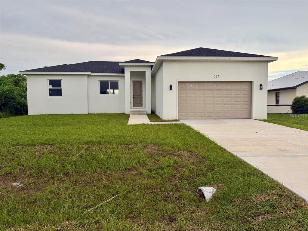 Photo of 571 Mimosa Avenue NW, Port Charlotte, FL 33952 (MLS # O6428536)