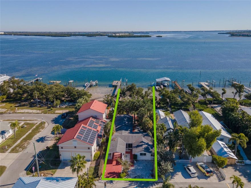 Gorgeous views of the bay & Intracoastal Waterway from this property on a quiet, serene street.  Home was remediated after the hurricanes of 2024 and is now a blank slate for a new owner to create their forever home on the water. This 2/2 home has good bones, vaulted ceilings and a nice floor plan to reinvent OR raze current structure to build a magnificent bayfront home on Anna Maria Island. Ideally situated right on the bay and just a short stroll to the beach with easy access... Waterfront parcel, PI#74413.0010/9 will convey with this sale.