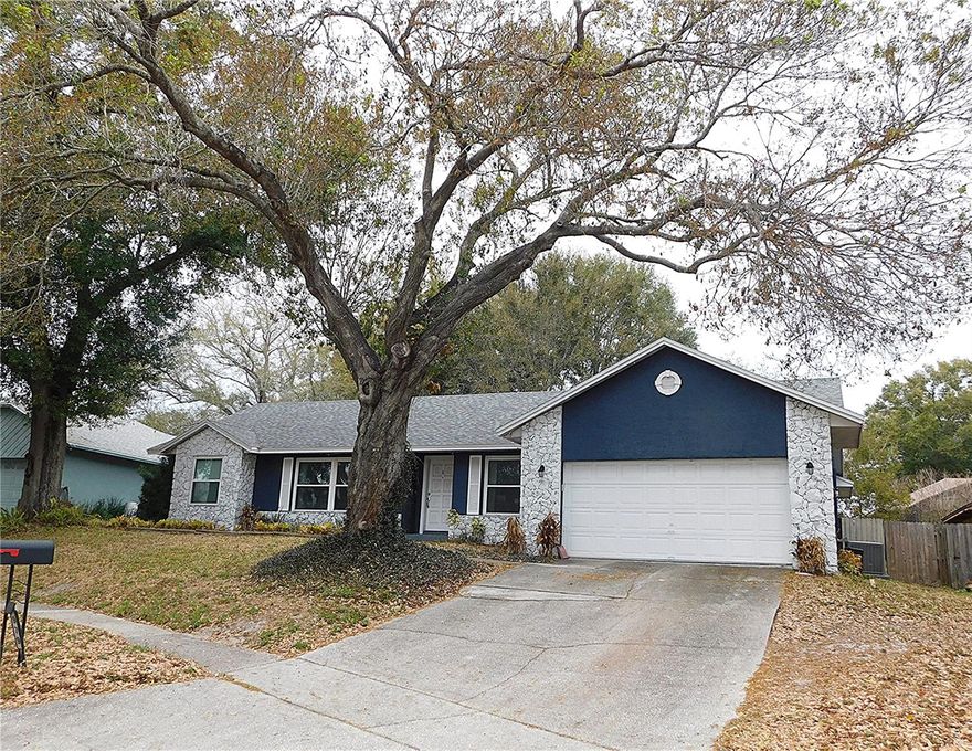 Well loved home with tons of potential in a well established neighborhood. This home has a NEW ROOF - 2025  NEW WINDOWS - 2024  Septic flushed - 2025  NEW DISHWASHER - 2026 Most of your big ticket items have been taken care of for you! 3 bedrooms and 2 baths with a split floor plan.  Wood burning fireplace. Screened patio  Large fenced yard. Beautiful pink Tabebuia tree in the back yard. Great central location in Florida.  Easy access to the 408, Hwy 50 and the 429.seller is offering a one year Home Warranty.