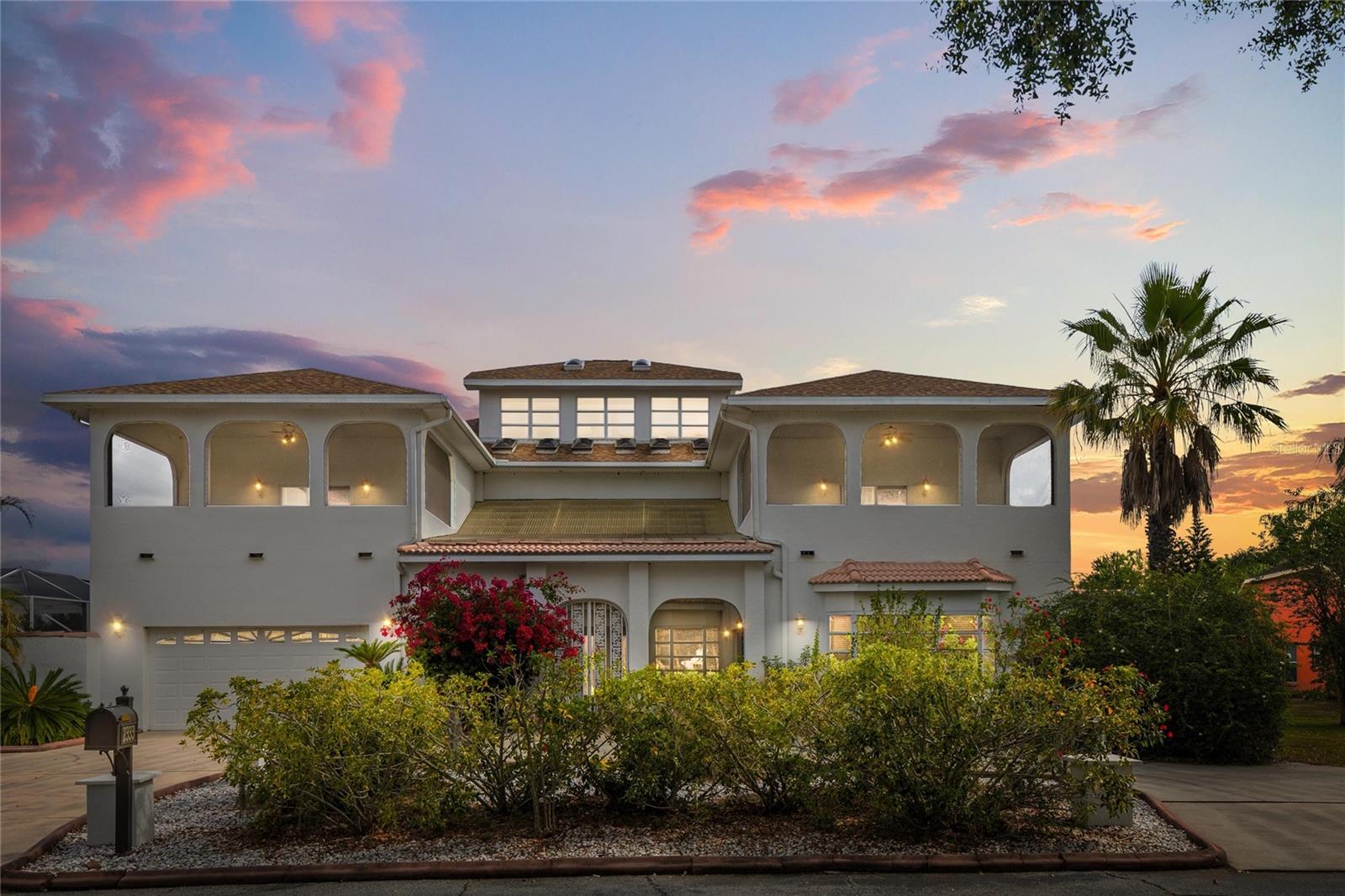 *** PRICE REPOSITIONED *** Welcome to your dream home at 2333 Camp Indianhead Road, a lakefront property nestled within the quiet, gated community of Natures Reserve. This exquisite residence spans an impressive 7,061 gross square feet- under roof, 5,812 SF heated and over 3,000 SF of screened lanai and balcony area, offering ample space for both relaxation and entertainment. With 5 bedrooms, 5.5 elegantly arranged bathrooms and a 2 car garage the home ensures comfort and privacy for all. The potential of this home is endless with an opportunity to use a section of the house as private guest quarters or as a personal gym or game room. Set on a sprawling 4.16-acre lot fronting Lake Jo Ann; you’ll experience tranquility in your private pool and spa, stunning picturesque views and unlimited lake access.
Step into unparalleled luxury where sophistication meets comfort in every corner. This magnificent home boasts an elevator for effortless access across its grand spaces. Enjoy peace of mind with a secure safe room and be captivated by the stunning marble staircase that adds a touch of elegance to the home. The central vacuum system ensures effortless maintenance while the gourmet kitchen dazzles with exquisite granite countertops and wood cabinetry, perfect for a myriad of culinary creations. With some TLC, the home is a sanctuary of refined living where every detail has been thoughtfully designed for your ultimate comfort and enjoyment. Recently sold properties in this community have highlighted the area’s appeal. And despite recent market fluctuations, the demand for homes in this waterfront community remains strong, making this property a premier investment. Experience the perfect blend of luxury and serenity in this remarkable property, a true haven in Land O’Lakes beautiful landscape. Call today for your tour!