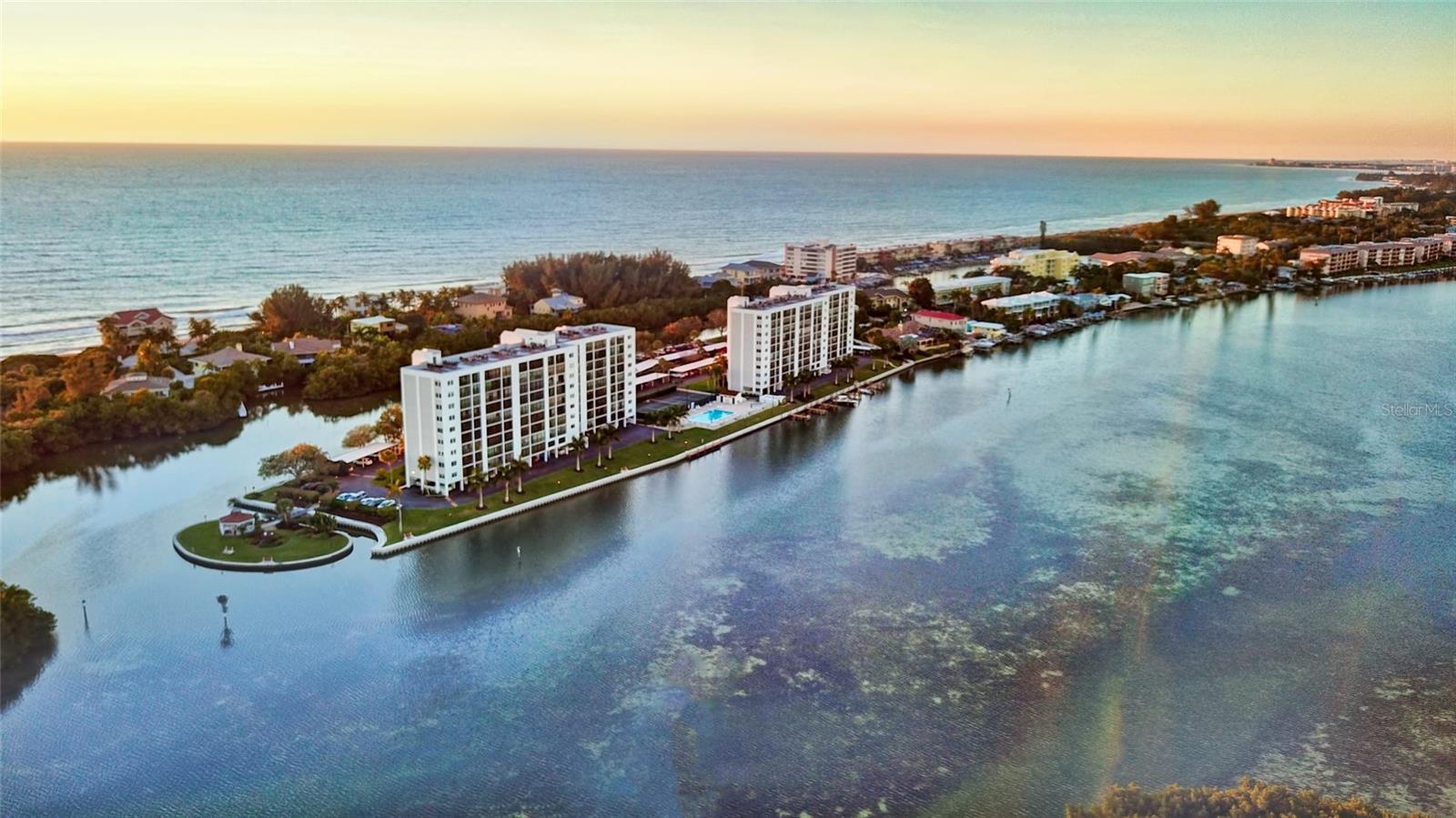 Your opportunity is here! The Penthouse perched on the top 10th floor, offers unparalleled 180-degree views of the Gulf of Mexico and Intercoastal Waterways. From sunrise to sunset, this condo captures the essence of coastal living. Step inside to discover a refreshed and elegantly staged interior. The one-bedroom ensuite, with its eastern water views, provides a tranquil retreat, while the spacious bathroom provides two private entrances. Easy-to-maintain hard surface flooring enhances the light and airy feel, seamlessly connecting to the enclosed lanai–a 22-foot-long glass-enclosed oasis that frames panoramic multi-waterway views. Convenience is ensured with assigned under-building parking, a dedicated 1st floor storage area & dual building elevators. Nestled in the historic southern tip of Siesta Key Island, this iconic gated community spans over 5 acres of natural beauty. Stay active in the fitness room, complete with men’s and women’s saunas. Enjoy the heated lap pool & spa. Boat docks are available for water enthusiasts and kayak storage and launch facilities make exploring the vast waterways a breeze. Lighted tennis and pickleball courts invite friendly competition and you can cross the bridge to a private island where BBQs, butterfly garden and fishing await. The Community Club House is a hub for social gatherings and onsite property management and maintenance provide peace of mind. Don’t miss the chance to embrace this coastal luxury opportunity. Contact me today for your private showing!
