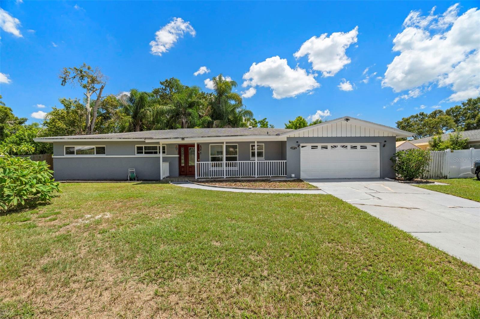 Welcome to this beautifully updated, move-in ready 4-bedroom, 2-bathroom block home, ideally located just off Gulf to Bay Blvd with quick access to US-19. Major upgrades include a newer roof and A/C system (both 2018) for peace of mind. This home has not experienced any wind or flood damage from hurricanes! The bright, open kitchen features white shaker cabinets, a marble backsplash, and stainless steel appliances, flowing into a spacious living and dining area, perfect for entertaining. A huge bonus room in the back with its own separate entrance, cabinets, and a fridge offers endless possibilities as a home office, guest suite, personal gym, or flex space! Located just minutes from Clearwater Beach, Tampa International Airport, shopping, dining, hospitals, and more. A clean 4-point inspection is available for review. Schedule your showing today!