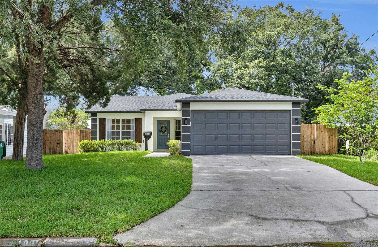 Under contract-accepting backup offers. Come check out this highly sought-after 3-bedroom, 2-bathroom, 1,370-square-foot home located in the heart of Riverside Heights, Tampa. This property comes equipped with a 2025 roof, a 2016 AC system, and a newer hot water heater. The kitchen features contemporary cabinetry, a spacious peninsula, fresh white quartz countertops, and brand-new white glass appliances, creating a clean and modern look. Just off the kitchen, you’ll find a thoughtfully designed corner coffee bar complete with contemporary shelving and a wine cooler—perfect for morning routines or evening wind-downs. Both bathrooms showcase modern vanities topped with quartz, new toilets, and stylish tile designs that give each space a sleek, cohesive finish. Throughout the home, you’ll find luxury vinyl plank flooring, fresh interior and exterior paint, and modern lighting and plumbing fixtures that tie everything together. One standout design feature of this home is the extensive trim work throughout—elevated, high-style trim frames the windows and doors, adding a bold yet refined finish across the interior. In the main living area, a custom batten detail wraps the lower portion of the walls, bringing in texture and a sharp, contemporary edge. The two-car garage is fully functional and includes washer and dryer hookups. Outside, enjoy a freshly screened back porch that opens to a backyard with brand-new sod added to both the front and rear of the property. You’ll also find two concrete slabs—one ready for a shed and the other topped with a brand-new pergola, perfect for outdoor seating or lounging. This home is conveniently located just 12 minutes from downtown Tampa and 7 minutes from Armature Works, placing you close to dining, shopping, and everything the city has to offer. Riverside Heights is known for its quaint cobblestone streets, rich historical character, and quiet, tree-lined charm. It’s a tightly held, highly desirable neighborhood that rarely sees homes hit the market—making this an incredible opportunity to own a piece of one of Tampa’s most treasured communities. With million dollar homes selling in the neighborhood this will not last long.