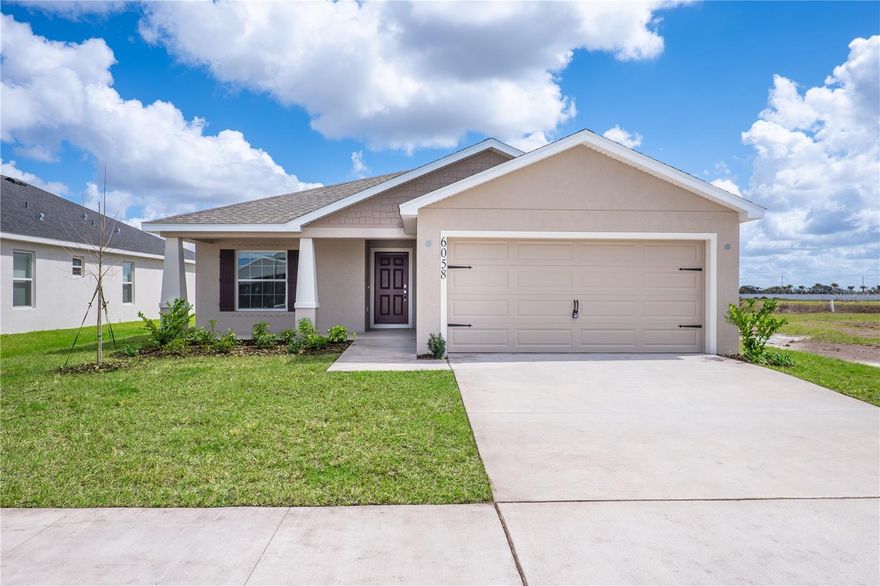 New construction home with 1,545 square feet on one-story including 3 bedrooms, 2 baths, and an open living area. Enjoy an open kitchen with Quartz countertops, Samsung stainless steel appliances, a walk-in pantry, and a spacious island, fully open to the dining café and gathering room. The living area, laundry room, and baths include luxury wood vinyl plank flooring, with stain-resistant carpet in the bedrooms. Your owner's suite is complete with a walk-in wardrobe and a private en-suite bath with a tiled shower, and a closeted toilet. Plus, enjoy a covered lanai, 2-car garage, custom-fit window blinds, architectural shingles, energy-efficient insulation and windows, and a full builder warranty. "Please note, virtual tour/photos showcases the home layout; colors and design options in actual home for sale may differ. Furnishings and décor do not convey.