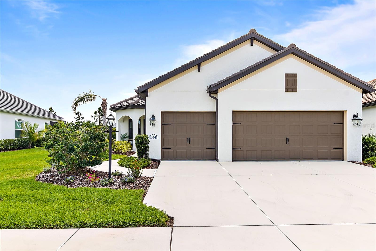 Seconds after stepping into the impressive entryway of this beautiful home, your mind will be made up! AVAILABLE NOW in the highly sought-after Grand Palm community. This delightful 3-bedroom, 2-bathroom, 3 car garage, Meadowbrook Model home will surely earn a spot at the top of your list. Convenient to everything that Venice has to offer, this home features plenty of stylish lighting and a neutral décor, the perfect blank canvas for your interior design talents. Tray ceilings give the home an air of luxury, while the large gourmet kitchen, looking like it came from a magazine, is the focal point of culinary endeavor. The kitchen is a visually appealing combination of inspiring counter space and stainless-steel GE appliances. The upgraded 42” cabinets, quartz countertops, large pantry and timeless tile backsplash will have you dreaming of cooking up all your favorite recipes. The classic island configuration maximizes workspace and flexibility while offering up plenty of storage space. Retreat to the primary-floor en-suite bedroom and recharge for tomorrow. Walk towards the primary bath and you’ll appreciate the twin walk-in closets, both of which have been upgraded with storage systems. The spacious primary bathroom with its dual sinks, large walk-in shower, linen closet and private toilet will be your own spa. The remaining two bedrooms--ready for guests or residents, and for your decorative touch-- also offer the convenience of ground floor accessibility. The three-car garage has a newly installed epoxy floor and leads into the drop zone area with a recently added bench with storage. Closing out this fantastic home is the Extended Lanai with privacy shades, the perfect spot to enjoy the fantastic Florida weather. The driveway has ample accommodation for visiting vehicles while the large and attractively landscaped yard is maintenance free, giving you more time to enjoy it. Facing the tree-lined street, the front porch is a nice spot for relaxing. Grand Palm offers an amenities list so extensive you may never leave!! Two resort pools with water slide, entertainment at the adventure playground, fitness center and fitness pool, miles of walking trails, pickleball courts, game gathering spaces, basketball, tennis courts, bocce ball, volleyball courts, fantastic dog park for dog lovers, the fun is endless and only limited by your imagination. Minutes to downtown historic Venice with its wide variety of restaurants, shopping, theater events and some of the best beaches in the country. Enjoy shelling, shark tooth searching, boating, water sports. The fast-growing Wellen Park is also minutes away and features a new downtown area with boutique shops, live music events and a selection of eateries as well as Cool Today Park, the Spring Training home of the Atlanta Braves. Schedule a showing at this move in ready home, today!
