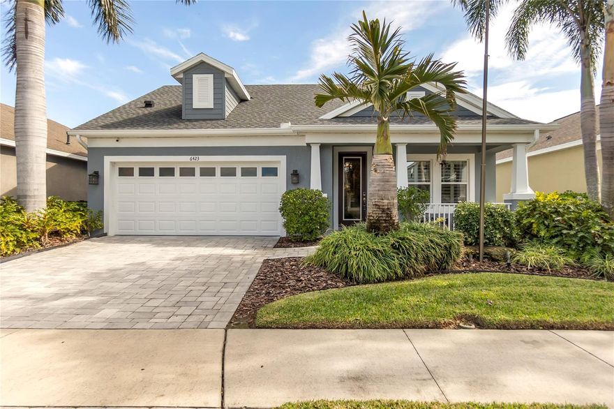 STUNNING HOME IN DESIRABLE WATERSET!! This immaculate triple-split floor plan features 3 bedrooms, 3 full baths, plus a den, and showcases unparalleled elegance, better than a model! The home offers an open layout with beautiful porcelain wood-look tile flooring throughout and coffered ceilings with wood in-lay in the foyer, living room, and primary bedroom, enhanced by custom shiplap accents in key areas. 

The kitchen is a chef's dream, equipped with upgraded appliances, two-tone cabinets, granite countertops, and a walk-in pantry featuring an upgraded glass door. Convenient USB outlets are installed in both the kitchen and master bedroom. Custom California Closets can be found in every closet, including the pantry, and a stylish barn door provides access to the primary bath, which boasts a double vanity with custom lighted mirrors.

The primary bedroom features a custom tray ceiling and a large picture window while the guest bedroom includes an ensuite bathroom. The third bedroom offers a walk-in closet. Upgraded French doors lead to the den, and all bathrooms showcase elegant fixtures, including custom glass barn doors in the secondary bathroom showers.

Throughout the home you'll find upgraded lighting, wired surround sound, smart home, a security system with closed-circuit cameras, exquisite doors, plantation shutters on every window, and bluetooth designer ceiling fans. A spacious laundry room provides; built-in cabinets, sink, pullout built-in dog bowls, fold-out ironing board, pulldown clothes drying rack. 

The garage features durable Snap Lock flooring, adding a touch of luxury. The exterior boasts low-maintenance landscaping, an outdoor built-in kitchen, saltwater & solar-heated pool. BONUS - New Roof & Pool Cage. This property has it all, come see it for yourself!