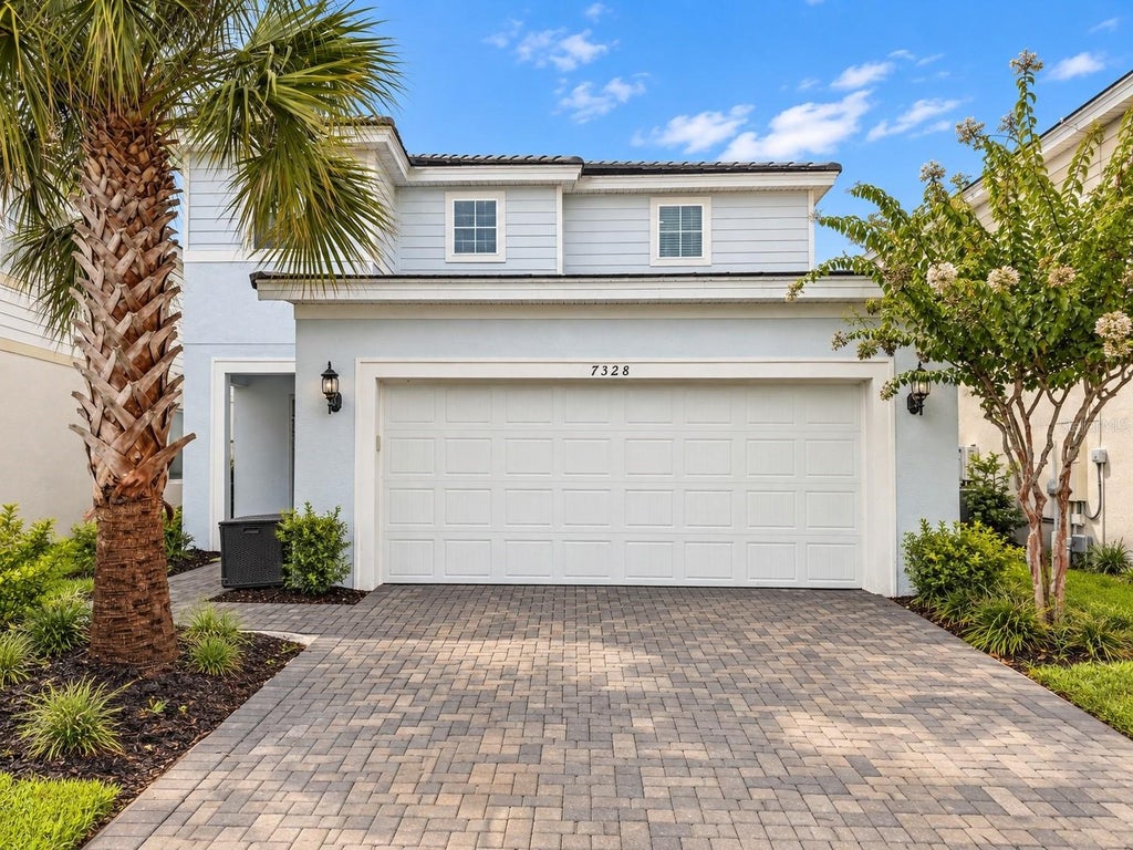 Photo of 7328 Oakmoss Loop, Davenport, FL 33837 (MLS # O6442574)