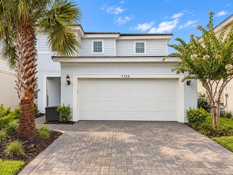 Photo of 7328 Oakmoss Loop, Davenport, FL 33837 (MLS # O6442574)