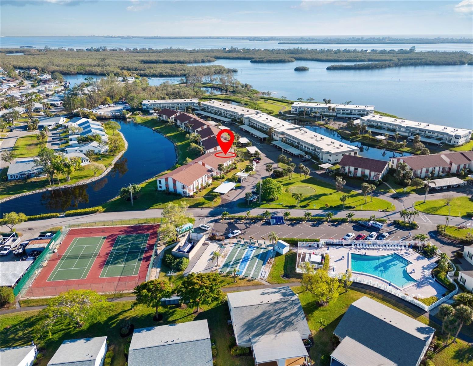 HIGHLY SOUGHT-AFTER 55+ COMMUNITY! JUST 5 MINUTES FROM THE BEACH!
Welcome to your breezy Bradenton retreat in the coveted coastal community of Mount Vernon, where the only thing missing is your favorite pair of flip-flops. This spacious 2-bedroom, 2-bathroom second-floor condo offers relaxed Florida living with serene pond views and glimpses of Sarasota Bay. Whether you’re here full-time or seasonally, this light-filled home checks all the boxes for comfort, convenience, and charm.
The former lanai has been thoughtfully enclosed to add flexible bonus space—perfect for a cozy reading nook, sunny office, or your go-to coffee corner. The open floor plan creates a bright and airy flow that’s ideal for entertaining guests or simply unwinding in peace. Plus, the community-maintained roof was replaced in 2019, offering added peace of mind and long-term value.
And when it comes to lifestyle, Mount Vernon delivers. This active 55+ community offers something for everyone:
Resort-style pool,
Pickleball & tennis courts,
Shuffleboard & boat slips,
Bayfront park, nature trails, butterfly garden,
Kayak launch & storage,
Clubhouse with library, game room, and banquet space.
Your monthly fee covers it all—cable, internet, water, sewer, trash, pest control, landscaping, and exterior maintenance—making stress-free living a breeze.
And the location? You’re just a 5-minute drive or a 20-minute bike ride across the bridge to some of Florida’s best beaches.
Whether you’re exploring the coast, enjoying happy hour with neighbors, or relaxing by the water, this is the kind of place that feels like vacation every day. Now priced below appraised value—this one’s a no-brainer.
Whether you’re settling in for the long haul, chasing that seasonal sunshine, or making a savvy investment move, this condo brings the vibe and the value. With its prime location and low-maintenance lifestyle, it’s the kind of place that just feels right.
Come take a look—you might not want to leave!
(One or more photos virtually staged)