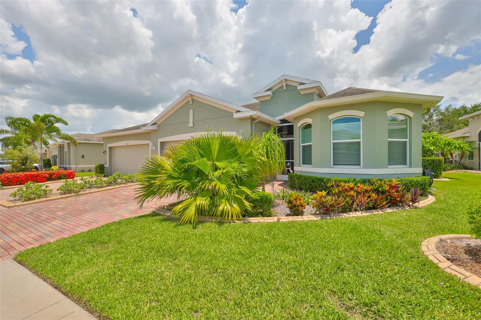 **CLICK ON 3-D TOUR ABOVE** VOTED #1 Retirement Community in the USA by Realtorcom & Travel & Leisure. ________________________________ONE OF A KIND VILLA!! GOLF COURSE & WATER VIEW - CONTEMPORARY & ELEGANT, TURNKEY VILLA with OVER $75K IN UPGRADES & HIGH-END features, is the best way to describe this MAINTENANCE FREE Villa in the desirable GATED community of Renaissance known as Verona, located directly on the ACTIVE RENAISSANCE GOLF COURSE! 70' ABOVE sea level, there is no flooding in this community! This villa just had a SHOW STOPPER, ALL SEASON, FLORIDA ROOM and CUSTOM PAVERED OPEN AIR PATIO added. The 'Magnolia", one of the most popular floor plans, is a 3 bedroom/2 bath home WITH A DEN and FULLY FURNISHED. This home is better than new and has been lovingly updated to include thousands of dollars of UPGRADES...such HIGH-END FEATURES as 3 SOLAR LIGHT TUBES, CONTEMPORARY LIGHT FIXTURES, MODERN CEILING FANS, 42” ALL WOOD cabinets, HYBRID HIGH EFFICIENCY SMART TANK HOT WATER HEATER, an exquisite EPOXY FLOOR in the garage & STORM SMART HURRICANE SCREENS for the window protection. Large, beautiful, LOW E-ENERGY EFFICIENT windows allow the Floridia sunshine to naturally filter throughout the home. The entire interior recently painted in CONTEMPORARY Floridian PAINT TONES of soft neutrals, accent the walls & TREY CEILINGS. The kitchen boasts of NEWER APPLIANCES & CUSTOM LIGHTING. There are 3 SOLAR TUBES, which brighten the kitchen, den and master bath naturally. The OWNER'S SUITE is relaxing & CALM WITH NEUTRAL tones being carried on through the master bathroom, which has HIGH END SHOWER HEADS. There is a HIS and HER WALK-IN closet combo for ultimate storage. All of the bedrooms are spacious and the large windows in the front bedroom allow NATURAL LIGHT into the room. The CUSTOM PAVER-STONE driveway, which has been sealed, adds a rich feel to the entrance, along with the GLASS HURRICANE IMPACT front door. The HUGE, BRAND-NEW Florida Room is the “piece Deri stance”. Overlooking the very active Renaissance Golf Course, along with a water view this room is exceptional. The room is surrounded by 4’ double pane windows which all have hurricane shutter protection. THEN you have a CUSTOM PAVERED OPEN AIRE patio to enjoy Florida sunshine, grilling, reading or entertaining. This is the ONLY villa in the community with this feature. Maintenance Free Living offers EXTERIOR MAINTENANCE (Roof replaced every 15 years, Exterior Painting and Landscaping) which are all taken care of by the HOA association. Nothing for you to do but enjoy all that this active community offers. The unique gated community of Verona has its own private, resort-style pool pavilion and all the pleasures of a hall of fame maintenance free retirement community. Come and enjoy the world-class country club, fine dining, resort style pool, state-of the-art fitness center, spa, saunas. Start living the dream!! Sun City Center has 3 beautiful clubhouses, hundreds of social and sports clubs, dance, theater, an arts and crafts building, state-of-the-art medical facilities, shopping, endless entertainment & resources all accessible by golf cart. Verona in Sun City Center is a great place to live! Come and see why this is the place to retire and have fun, especially with this home.