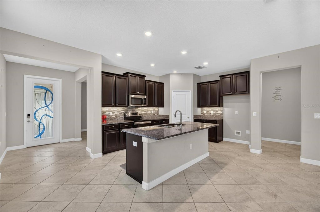 Photo of 16836 Whisper Elm Street, Wimauma, FL 33598 (MLS # TB8548349)