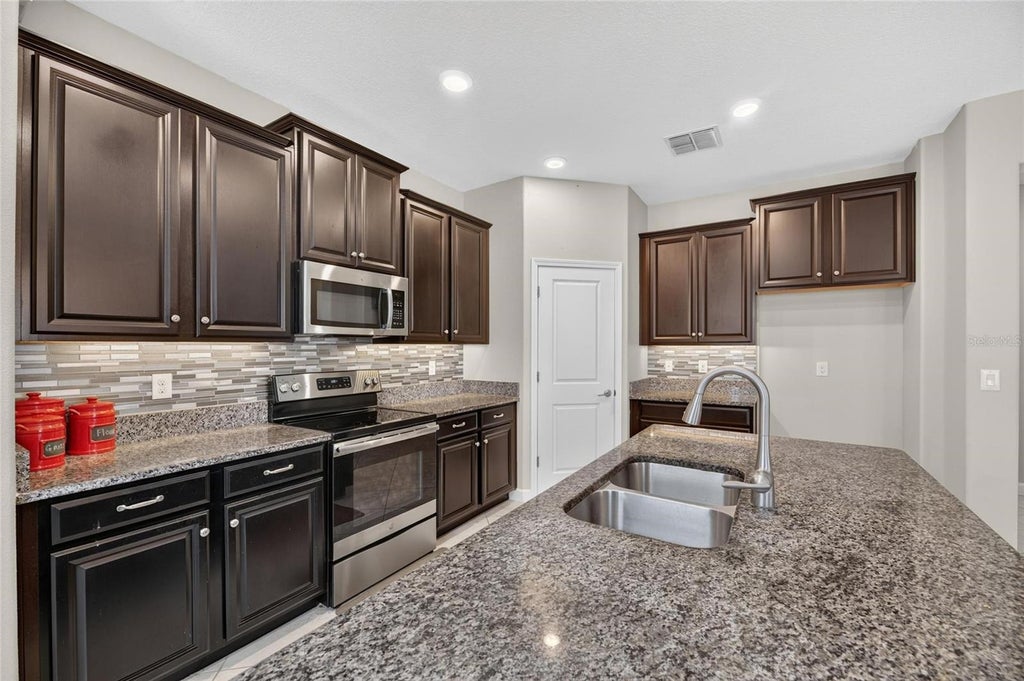 Photo of 16836 Whisper Elm Street, Wimauma, FL 33598 (MLS # TB8548349)