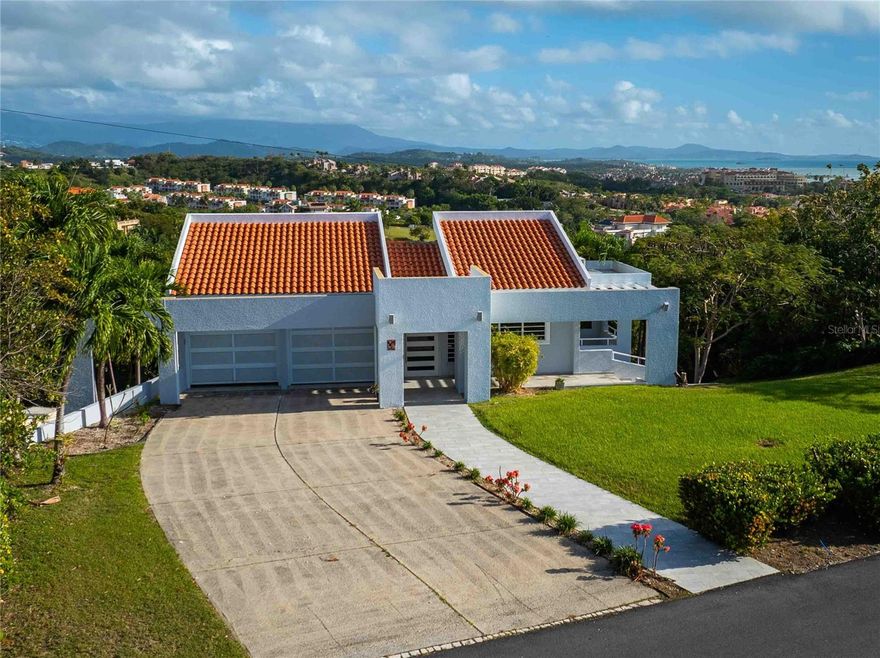 One or more photo(s) has been virtually staged. Priced UNDER Appraisal! Located in the highly sought-after Port Road in Palmas del Mar, this residence offers a unique opportunity to own a prime property within one of Puerto Rico’s premier resort communities. Ideally situated, the home enjoys expansive views and a privileged setting that combines privacy, comfort, and resort-style living.

The interior layout is designed for both everyday living and entertaining, featuring bright, open-concept spaces with seamless indoor-outdoor flow to maximize natural light and tropical breezes. The property provides a strong foundation for customization or enhancement, depending on the buyer’s vision.

Offered below appraisal value, this home is competitively positioned for a timely sale—an exceptional opportunity for buyers seeking location, value, and long-term investment potential in Port Road, where availability is limited.

Residents of Palmas del Mar enjoy access to world-class amenities including golf courses, marina, tennis center, restaurants, preK-12th grade school, and more, all within a gated community with 24/7 security. Golf, tennis/pickelball, and beach club are part of a separate membership with the Palmas Athletic Club.

Property details: 2,073 m² lot (0.51 acres), 2,236 sq. ft. interior living space, 4,581 sq. ft. total construction (including terraces and two-car garage). HOA: $1,300/year. Property taxes: $2,632/year. Includes 20k diesel generator.

Motivated Seller! Bring your offers!