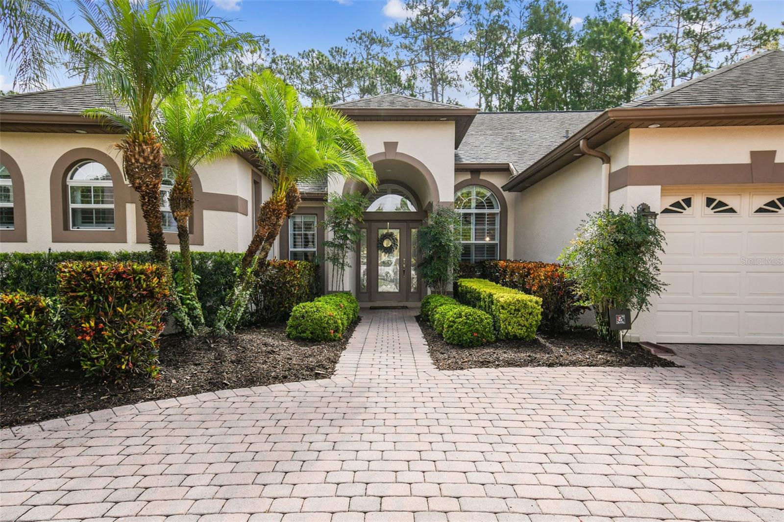 This stunning home is located in Oviedo in the Live Oak Reserve community on a conservation site with beautiful wood views. It features 4 bedrooms, 3 bathrooms and an office, making it spacious and accommodating for anyone. Loaded with high-end upgrades, the interior of the home is equally impressive. The upgraded kitchen boasts a quartzite stone island, providing a stylish and functional space for cooking and gathering. The kitchen is complemented by 42-inch cabinets, offering ample storage for all your culinary needs, and it seamlessly flows into a combination of a large family room and a dinette area, making it a great space for everyday living and hosting guests. Crown molding adds an elegant touch to the home, enhancing the overall aesthetic. Additionally, the property includes a private home office located near the large and elegant master bedroom. The trey ceiling in the master bedroom makes the room feel even more luxurious. This property features a fantastic pool area with a grotto and waterfall, creating a serene and resort-like ambiance. Additionally, there is a spa where you can relax and unwind after a long day. The pool area is perfect for outdoor entertaining and enjoying the Florida weather.The house is equipped with double-pane windows, which help with energy efficiency and noise reduction. The roof was newly installed in 2015, ensuring its durability and longevity. The air conditioning system was also updated in 2020, offering reliable cooling for the home. Living in Live Oak Reserve comes with its own set of benefits. As part of the Live Oak Reserve community, residents have access to a variety of amenities, such as a resort-style pool with a splash pad, a fitness center, a clubhouse, basketball and tennis courts, and playgrounds. The community is surrounded by picturesque wooded conservation areas, providing a peaceful and scenic environment.Furthermore, this property is zoned for top-rated schools. Its convenient location near the Research Park, UCF, Seminole State College, hospitals, restaurants, shopping centers, and other amenities adds to its appeal. Don't miss out on this amazing opportunity to live in Live Oak Reserve!