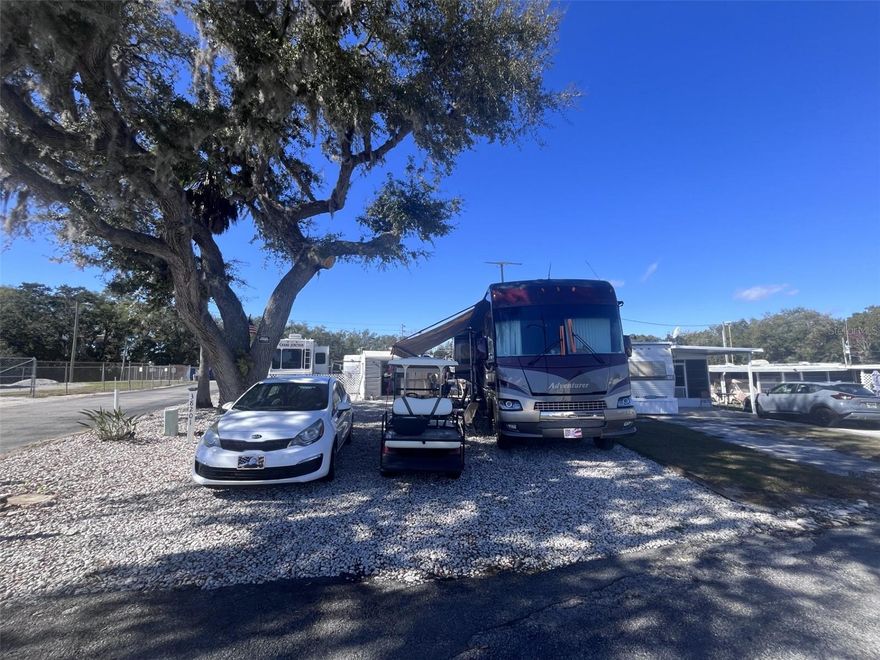 BEAUTIFUL CORNER DOUBLE LOT, YOU OWN THE LAND, WITH A LOW HOA!!! This property is a fisherman's paradise in a community located on Lake Yale, a 4,000+ acre beautiful lake with great fishing and water sports options. The community has it's own boat ramp and a fish cleaning station for you to enjoy the sport from the convenience of the community! There is a 50-amp RV hookup (you pay the electricity) with sewer and water included in your low HOA fee, the property is also wired for internet! This lot features a storage shed that has been upgraded with a ceiling fan, electricity and a full-size washer and dryer that will remain with the property. There is a beautiful sitting area in the back with a sunshade, lights and outdoor furniture and a grilling station for you to sit and enjoy! You can bring your own RV or have a Park Model installed, the RV can be stored on your lot year-round when not in use. Want extra income? You can rent it out when you are not using it, (HOA approval required). The possibilities are endless!! Located close to shopping, medical facilities with a rural feel makes this a perfect winter vacation getaway!