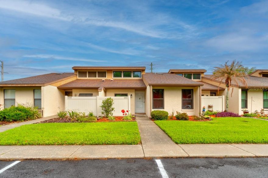 Welcome to easy Florida living in this move-in ready 2-bedroom, 2-bath single-level condo located in a quiet townhome-style community. With no stairs, this home offers comfort and convenience throughout. The bright great room features vaulted ceilings and skylights, creating an open, airy feel. The layout flows into the dining area and kitchen, ideal for everyday living and entertaining. Enjoy the enclosed Florida room for added living space, plus a private storage closet. Inside laundry includes washer and dryer. Low condo fees provide affordable maintenance living. Residents enjoy a clubhouse and community pool in a peaceful setting. Perfect as a primary home, seasonal retreat, or low-maintenance investment.