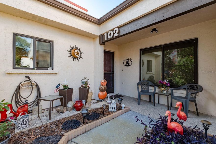 This fully updated, corner unit, villa/townhouse with a garage offers a perfect blend of comfort, space and convenience. Step inside to find an open layout with luxury vinyl plank flooring throughout and a modern kitchen featuring stainless steel appliances. The split floor plan provides privacy for both bedrooms, while the indoor laundry adds everyday ease. Primary Bathroom includes Double Sinks and Walk In Shower! Enjoy the wrap-around lanai with multiple sliders, over looking the lush green landscaping, perfect for relaxing or entertaining year-round. With its private entry, stylish updates, and low-maintenance living, this villa is move-in ready and waiting for you to call it home.