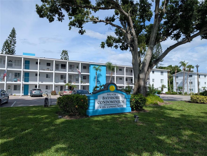 Pretty 1BR/1BA at a SUPER PRICE. Top floor convenience (no one overhead, very few this size are available).  Impressively clean & turnkey furnished with many little extras included: ‘move-in-today’ condition! You'll truly want to live out on this newly updated totally enclosed (vinyl/screens/ceiling) lanai every winter – BEST possible view! Quiet, park-like setting, gentle breezes. Come check out the appealing Fourth Bayshore 55+ community & its heated pool/spa, clubhouse, spacious coin laundry, bocci & shuffleboard courts. There are even multiple picnic tables & gas grills for cookouts. Lots of planned activities & fun times thru the season. Great location...only a couple blocks to Bayshore Gdns Shopping Center (Target, Publix, TJMaxx, BofA, Chick-fil-A, etc). Public library is just down the street. Public bus stop is right in front and there are plenty of nearby places to eat & enjoy as well as banks, medical offices, golf courses & miles of beautiful beaches. Now is ABSOLUTELY the time to act. Interested? Now is the time, don't wait...