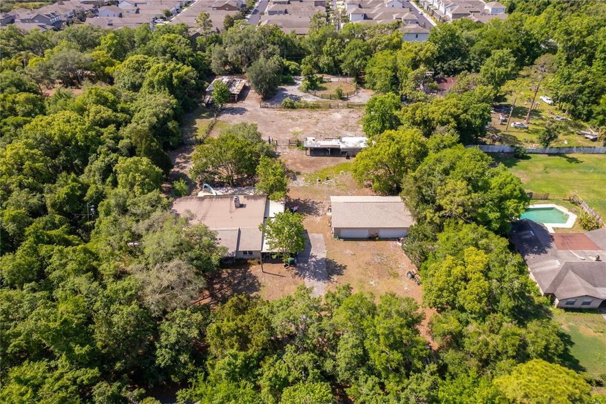 Experience the beauty of city living on 2.3 acres in the highly desirable city of Winter Springs with no HOA—where open space, natural surroundings, and an equestrian friendly lifestyle come together. This unique property offers the freedom of rural living while remaining conveniently located near the Tuscawilla area.
The fully usable acreage is ideal for horses, cattle, or other livestock. If livestock isn’t your preference, the expansive space is perfect for recreational vehicles, racing cars, or other outdoor hobbies. The 5 bedroom, 3 bath home is solid and ready for your personal updates. A standout feature is the 1,500 sq. ft. garage, offering ample room for a boat, race cars, or additional storage.
This 2.3 acre parcel is one of the few remaining equestrian friendly properties in the city of Winter Springs, providing a rare combination of comfort, privacy, and natural surroundings.
The home is zoned for highly rated Seminole County schools, offering the perfect blend of private country living and excellent educational opportunities. Seller motivated!