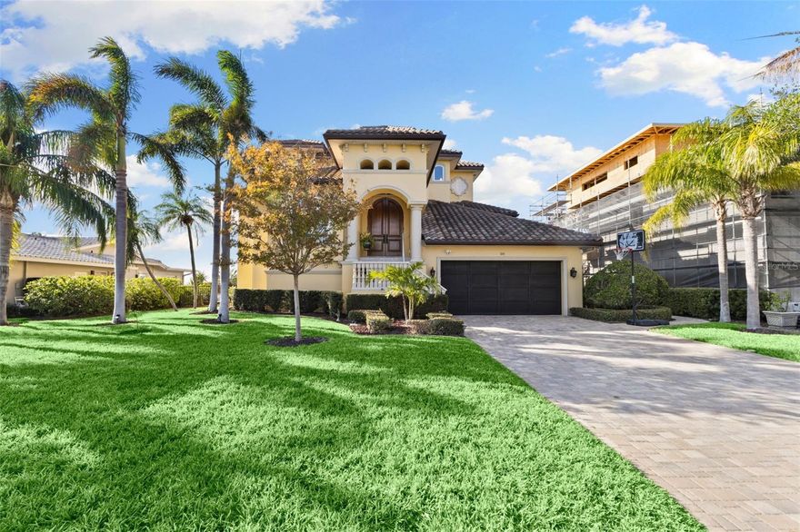 Seller is Motivated! Welcome to your waterfront paradise at 110 Driftwood Ln in the Harbor Bluffs community. The exterior is finished in a warm, inviting yellow hue with dark tiled roofing. The property is surrounded by lush, manicured lawns and mature palm trees, providing a tropical oasis feel, and a spacious driveway that leads to a large 3 car garage. As you step inside to an open and airy living area that seamlessly blends indoor and outdoor living. The living room boasts large sliding glass doors that open to a stunning view of the water, allowing for an abundance of natural light and a refreshing breeze. The gourmet kitchen is a chef's dream with custom wood cabinetry, granite countertops, and a large island perfect for entertaining. Stainless steel appliances and a stylish range hood complete this space, with bar seating for casual dining.  Adjacent to the living room, the family room is a bright and inviting space with panoramic windows that bring the outside in. This room is perfect for relaxation with plush seating, wine refrigerator, elegant decor, and direct access to the outdoor patio with a wine refrigerator. Still on the second level there are two bedrooms with valued ceilings while a jack and jill restroom is in between. The primary suite is a tranquil retreat with plenty of natural light from a large arched windows, and a soothing color palette that enhances the calming atmosphere. The garage area has plenty of room for not only 3 vehicles but all of your storage. There is full bathroom on the ground floor along with another room that can be used as a fitness room with views overlooking the intercoastal. The outdoor area is designed for leisure with a private pool and hot tub, surrounded by a spacious patio. The waterfront location provides a serene backdrop, ideal for social gatherings or quiet evenings. This home offers privacy with the convenience of being close to local amenities, including shopping, dining, and recreational facilities. Enjoy the exclusivity of waterfront living. Contact me for a showing.