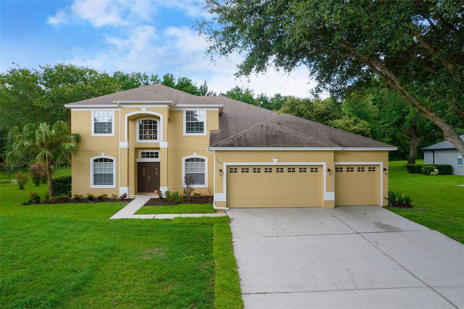Welcome to 3617 Haddington Court in Rock Springs Ridge, a spacious 5-bedroom, 3-bath, two-story pool home with a 3-car garage sitting on a shy of half an acre. This beautifully maintained property offers a formal living and dining room, a family room with a fireplace, and a generous eat-in kitchen with a breakfast bar and included appliances. The first-floor master suite features a walk-in closet, dual sinks, a garden tub, and a separate shower, plus an adjoining flex room perfect for a home office or nursery. Upstairs you’ll find a loft, two bedrooms, a full bath, and a large bonus room ideal for additional living space. Recent improvements include a roof less than 5 years old, AC units less than 4 years old, a new water heater, fresh interior paint, and new laminate flooring throughout the second story. Enjoy the screened-in heated pool overlooking the expansive backyard with no rear neighbors and the 12-acre conservation area. This move-in-ready home combines privacy, space, and modern updates—schedule your private tour today!