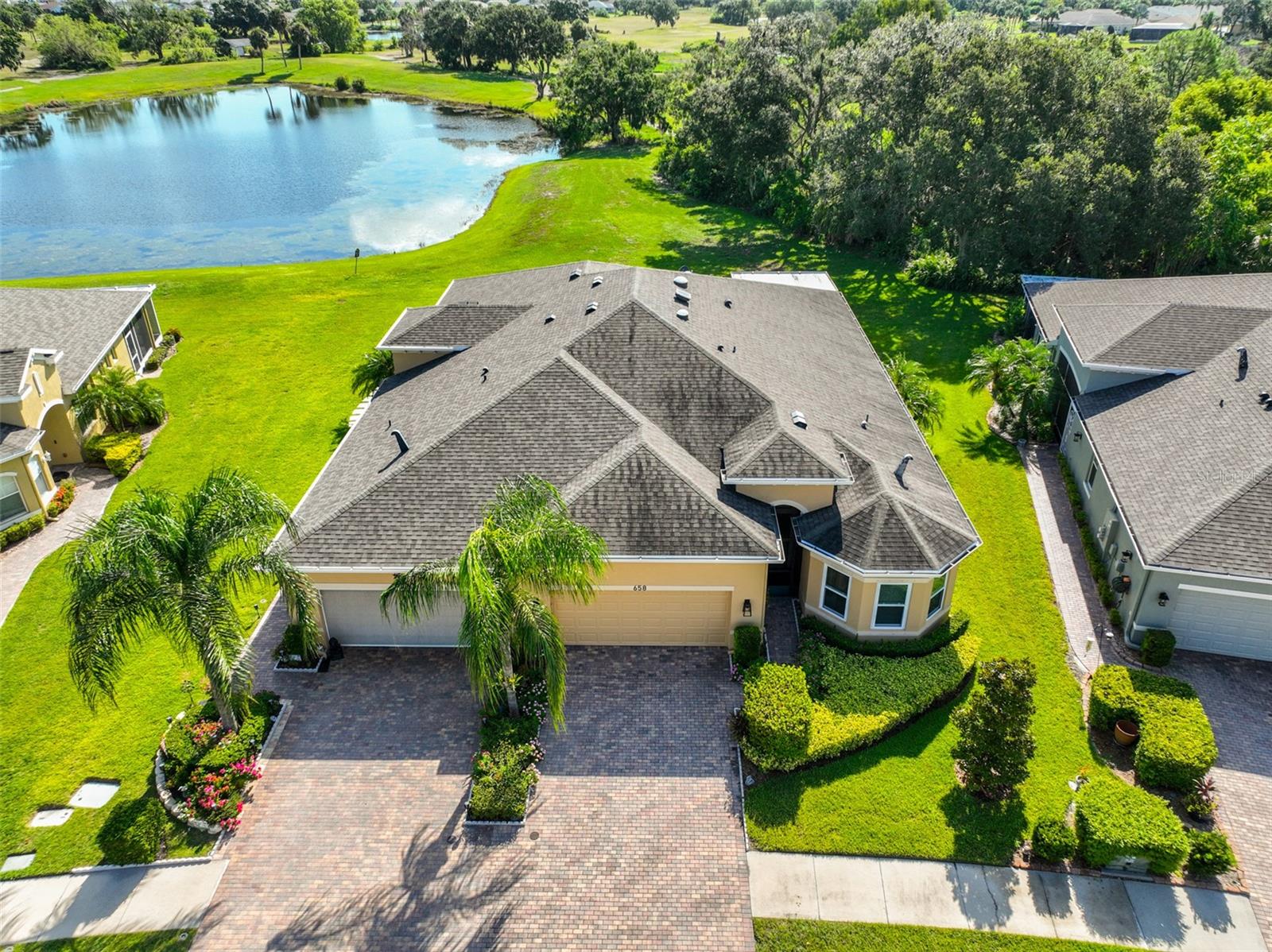 Click On 3D Tour Above --------- LUXURIOUS VILLA WITH NUMEROUS PREMIUM UPGRADES! Welcome to active retirement living at its finest, in the GATED community of Verona, within Sun City Center, FL, where you'll feel like you're on vacation every day! This immaculate & perfectly maintained "MAGNOLIA" model boasts 1800 SQ FT of living space that includes 3 SPACIOUS BEDROOMS, 2 FULL BATHROOMS, PLUS A DEN. This home is situated on a lushly landscaped lot in a peaceful neighborhood. Step inside and be wowed by the beautiful "wood-look" porcelain tile flooring throughout, 7-inch crown molding & base boards throughout, coffered ceilings, 3 solar tubes for extra light, neutral decor and custom blinds & draperies. The large great room/dining room combo is the perfect space for all your entertainment needs and also has a slider for easy access to the lanai area. The gorgeous kitchen is extra light & bright w/added solar tube, has 42 inch wood cabinetry w/under cabinet lighting, quartz counters and backsplash, stainless appliances, including a new range and a large breakfast bar, all wide open to the great room/dining room. The den/office boasts lovely custom built-in office cabinets & desk plus another solar tube for premium light. The private owner's suite has plenty of space for a king size bed, deep closets for maximum storage, double sink vanity & pretty tiled & glassed walk-in shower. The front guest bedroom has impact glass windows and custom built-in office system. The 3rd bedroom can easily be used for your hobbies or simply a quiet space to relax. When you want to unwind, retreat to the peaceful 13 x 21 covered & screened lanai where you can enjoy the various birds & wildlife in the peaceful green space & wooded area. For an added bonus, this home is just a short walk or golf cart ride to the neighborhood pool down the street. You'll also have access to Club Renaissance where you can enjoy dining, drinks, social activities, resort-style pool, fitness classes & spa. Sun City Center also offers a wide range of amenities such as shopping, restaurants, banking, doctors, various social clubs, sports and so much more. So come & visit this beauty today and see why you'll want to call it home!