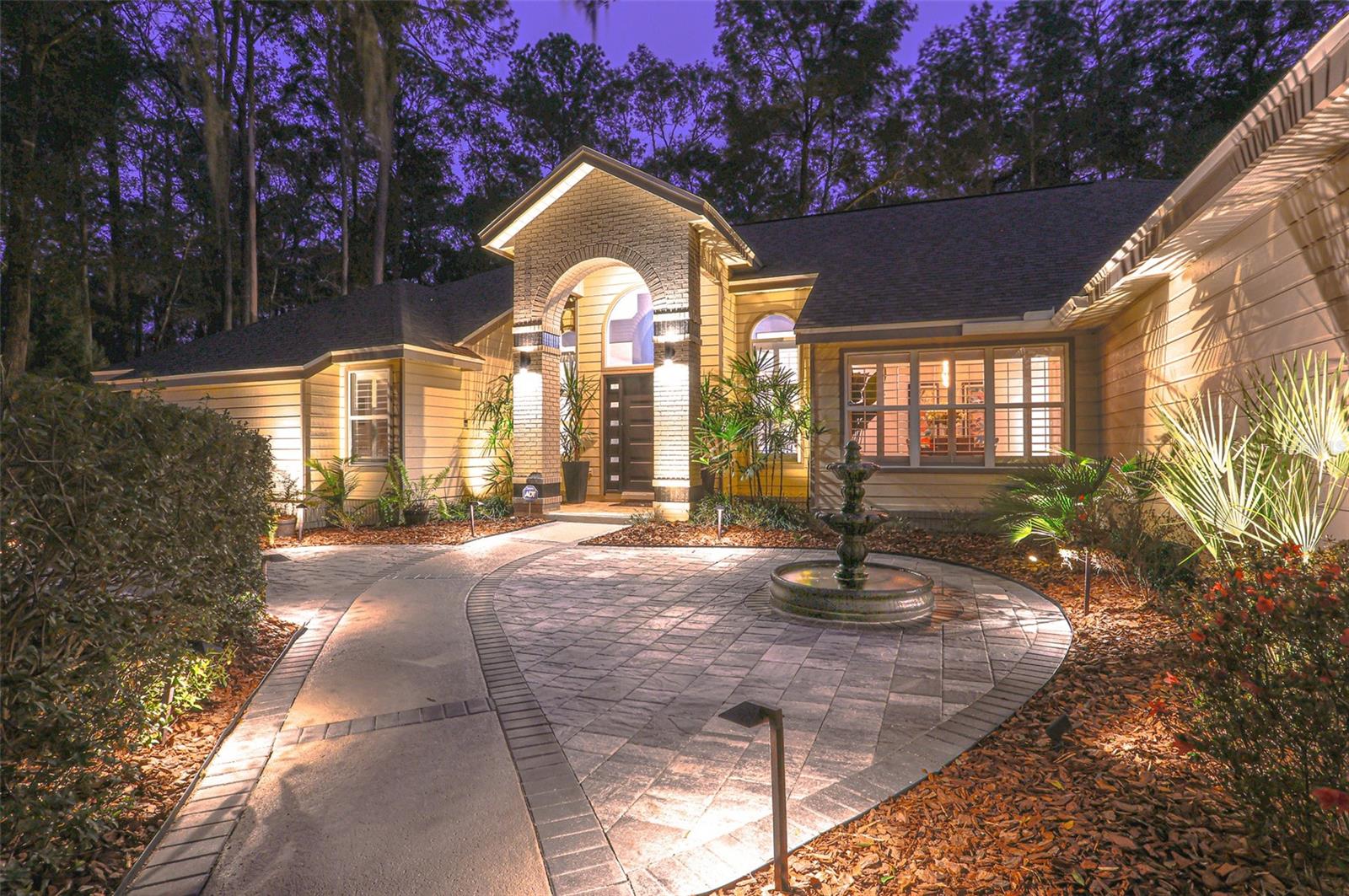 Luxury Living in Haile Plantation. Discover refined elegance in this completely updated five-bedroom, three-and-a-half-bath home, ideally located on a private cul-de-sac in Haile Plantation Spalding Place neighborhood. Backing up to a preservation area, this residence offers exceptional privacy and picturesque natural views.
Inside, no detail has been overlooked. The home showcases, LVP flooring throughout, exquisite crown molding, custom trim work, and high-end finishes throughout. The thoughtfully designed layout includes a private in-law suite with its own entrance, offering flexibility for extended family or guests.
The spacious master suite is a true retreat, featuring a walk-in shower, soaking tub, dual-sink vanity, and custom-designed closet. On the opposite wing of the home, you’ll find three additional bedrooms and a full bath, creating ideal separation and flow. A light-filled Florida room overlooks the serene backyard, adding charm and additional living space.
Step outside to your own backyard oasis—fully fenced and complete with peaceful water features, firepit, stone paver walkways, up lighting and lush landscaping—perfect for entertaining with pass through window to kitchen, and Lanai with 1/2 bath and TV.
The two-car garage is fully insulated, soundproofed, and climate-controlled—perfect for hobbyists, musicians, or creative projects. A separate golf cart garage adds extra convenience.
Living in Haile Plantation means enjoying an unparalleled lifestyle, with over 15 miles of scenic walking trails and the vibrant Haile Village Center offers shops, dining, and a beloved weekly farmers market—all just a short walk away. Join the Hawkstone country club and have access to their golf course, three swimming pools, tennis and pickleball courts, and fitness center.
This home isn’t just a place to live—it’s a gateway to luxury, comfort, and community in one of Gainesville’s most sought-after neighborhoods.