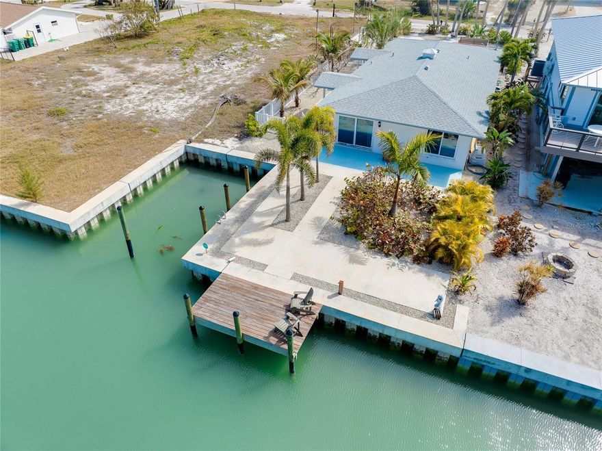 Located on the highly desirable southern tip of MANASOTA KEY, 170 Mockingbird Lane presents a rare opportunity to own WATERFRONT property on one of only two CANALS serving this exclusive beachside community — a true boating paradise for anglers and shelling enthusiasts alike — with fast access to Stump Pass and the GULF.
Situated on a generous 50’ x 160’ lot, this property features a 30’ PRIVATE BOAT BASIN and a newer SEAWALL installed in 2023, offering DIRECT ACCESS TO LEMON BAY and a short boat ride through deep water and mangroves to some of South West Florida’s best fishing. A few features you'll be sure to enjoy are the PRIVATE TEAK WOOD OUTDOOR SHOWER, canal side TEAK DOCK (8' x 15') and the convenient dockside hose bib , perfectly located so you can wash your boat and gear after a long day out on the water. Enjoy an incredible sunrise coffee from the dock and step onto your boat, kayak, or paddle board for an amazing day on the water. Take a short walk to Stump Pass State Park or across Manasota Beach Road to the neighborhood’s beautiful beach access for an incredible Florida sunset. 
The existing residence was a 2-bedroom, 2-bath home designed to capture incredible canal views with tropical landscaping and ample hardscape designed to enjoy tropical breezes and the relaxed charm of coastal living. The home was affected by the hurricanes of 2024 and is now ready to be restored to its former glory — or removed to make way for a new, elevated coastal contemporary masterpiece that maximizes views, outdoor living, and modern design.
Whether you envision renovating the original footprint or building a brand-new waterfront retreat, the value here is in the prime canal-front location, protected boat basin, and new seawall — all in one of Manasota Key’s most coveted boating neighborhoods. Why pay expensive marina fees or monthly storage costs when you can keep your boat and trailer right at home for free? Enjoy the convenience of having it ready whenever you are — no extra bills, no long-term contracts, and no waiting on access.

This is a rare chance to create your ideal waterfront lifestyle in a setting that truly captures the essence of Southwest Florida coastal living. As an added bonus, the two adjacent properties are also for sale by a separate land owner. Potential to combine the three lots certainly exists.