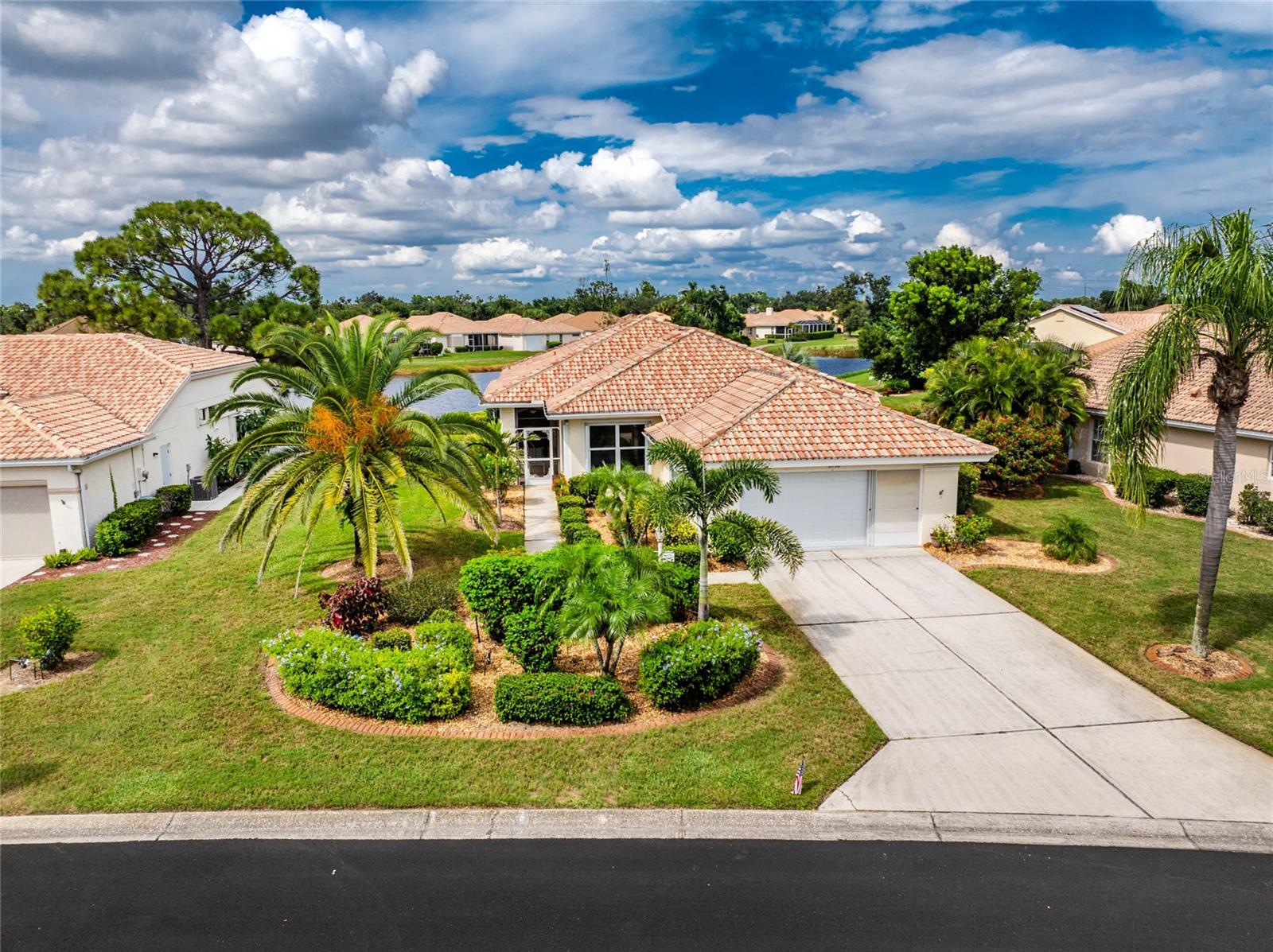 One or more photo(s) has been virtually staged. Welcome to Oyster Creek Golf & Country Club, one of Englewood’s most sought-after gated communities, where everyday living feels like resort life. This 3-bedroom, 2-bath home offers nearly 2,000 sq. ft. of living space designed for comfort and connection. With an open floor plan, high ceilings, and walls of sliding glass doors that bring in natural light and sweeping lake views.
The spacious kitchen with island and breakfast nook is the heart of the home, perfect for casual mornings or entertaining. A large primary suite with serene water views, walk-in closet, and spa-like bath provides the ideal retreat. Recent updates include Coretec luxury flooring (2022), a new water heater (2021), newer roof (2017), A/C (2016), and irrigation pump (2023) giving peace of mind for years to come. Step outside to the enclosed lanai overlooking the lake, where you can enjoy morning coffee, evening sunsets, or the tranquil sounds of nature.
Life in Oyster Creek means more than just a beautiful home it’s about lifestyle. Residents enjoy a private 18-hole golf course, pickleball and tennis courts, a community pool & spa, fitness center, library, and a clubhouse buzzing with activities. With lawn care, cable, internet, and security included, you’ll spend less time on chores and more time living.
And when you want to explore, you’re just 5 miles from the Gulf beaches, world-class fishing, kayaking, and waterfront dining. Shopping, farmers markets, and restaurants are just outside the gate, making every day convenient and fun.
If you’re ready for a home that blends comfort, community, and the ultimate Florida lifestyle, this is it!