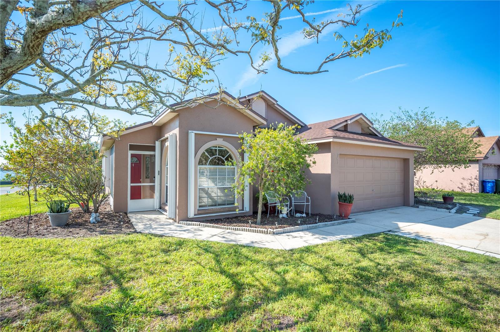 Experience the perfect blend of comfort and style in this stunning 3-bedroom, 2-bathroom home, nestled in the sought-after Reflections East community—just minutes from LEGOLAND! Move-in ready with modern updates, this home features a newer roof (2019), some newer windows (2020), and a newer air conditioner (2022) for worry-free living. Designed for effortless everyday life, it offers a warm and inviting atmosphere, perfect for both relaxing with family and entertaining guests. At the heart of the home, a modern kitchen boasts sleek stainless-steel appliances, including a refrigerator, dishwasher, and range. The open-concept layout seamlessly flows into the dining area and spacious living room, creating the perfect space for gatherings. Step outside to the screened-in back patio, where serene lake views provide the perfect backdrop for your morning coffee or evening get-togethers. With breathtaking views, thoughtful updates, and a prime location, this home truly has it all. Don’t miss your chance—schedule a showing today!