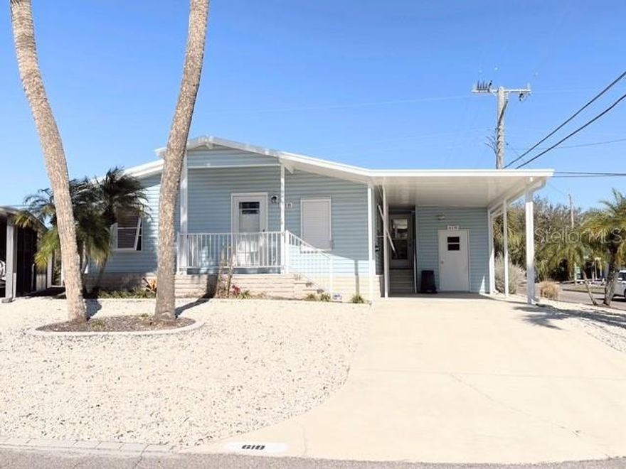 BOATING COMMUNITY!  This 2-bedroom 2-bath home sits near the entrance of Country Club Estates, on a corner lot with beautiful palm trees and landscaping. From sitting on your front porch, to enjoying your bright and cheerful lanai. This home has updated appliances, water heater, air conditioning, carport in 2025, hurricane shutters in 2024, along with many other items for you to see. The Venetian Trail is just steps away for walking and riding your bike. This is resort style living. This beautiful community is located on Venice island. Enjoy the heated pool with water aerobics and exercise classes, Country Club Estates has two clubhouses. Each with a kitchen. One clubhouse has a stage for bands and performances. The other overlooks the waterway with rented boat slips for the residents. From the boat club to the book club, you will probably find it here. Pickleball, shuffleboard, corn hole, billiards, ping pong, library, fitness center, most card games, karaoke, events planned for the holiday, local bands and DJ's for dances, neighborhood parades and scavenger hunts. Too many to list. This is not just a place to live--it is a lifestyle. Come see for yourself.