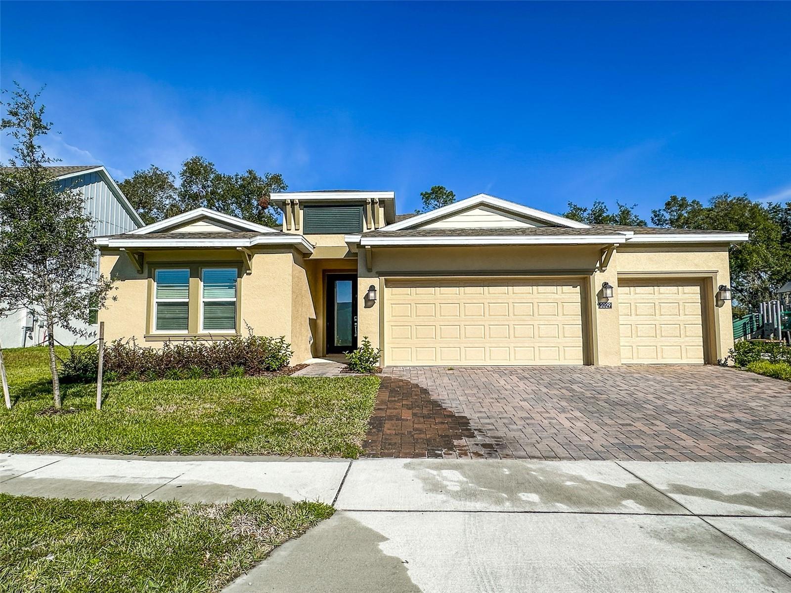 This beautifully maintained 4-bedroom, 3-bathroom single-story home with a spacious three-car garage is located in the highly desirable Rhett’s Ridge community. Built in 2024 and only occupied by one tenant, the home feels like new. Enjoy privacy with no rear neighbors and peaceful green views, all while being just steps from the community playground. Inside, the thoughtfully designed open-concept layout welcomes you with a foyer that flows into a formal dining room and a versatile flex space—perfect for an office or additional living area.
The expansive family room connects seamlessly to the chef’s kitchen, breakfast nook, and covered lanai, creating an ideal space for both everyday living and entertaining. The home offers three comfortable secondary bedrooms, while the owner’s suite serves as a private retreat with its spa-like en-suite bathroom. Sliding glass doors extend your living area outdoors to the lanai, where you can relax and enjoy the tranquil surroundings. Rhett’s Ridge residents enjoy family-friendly amenities, including a tot lot and scenic walking trails, with state parks, trails, and springs nearby. Conveniently located near the 429 connector and Highway 441, the home provides quick access to shopping, dining, entertainment, and Central Florida’s world-class attractions. Rent includes internet. Tenant is responsible for utilities, lawn care, and pest control. Tenant occupied until 9/30/25.